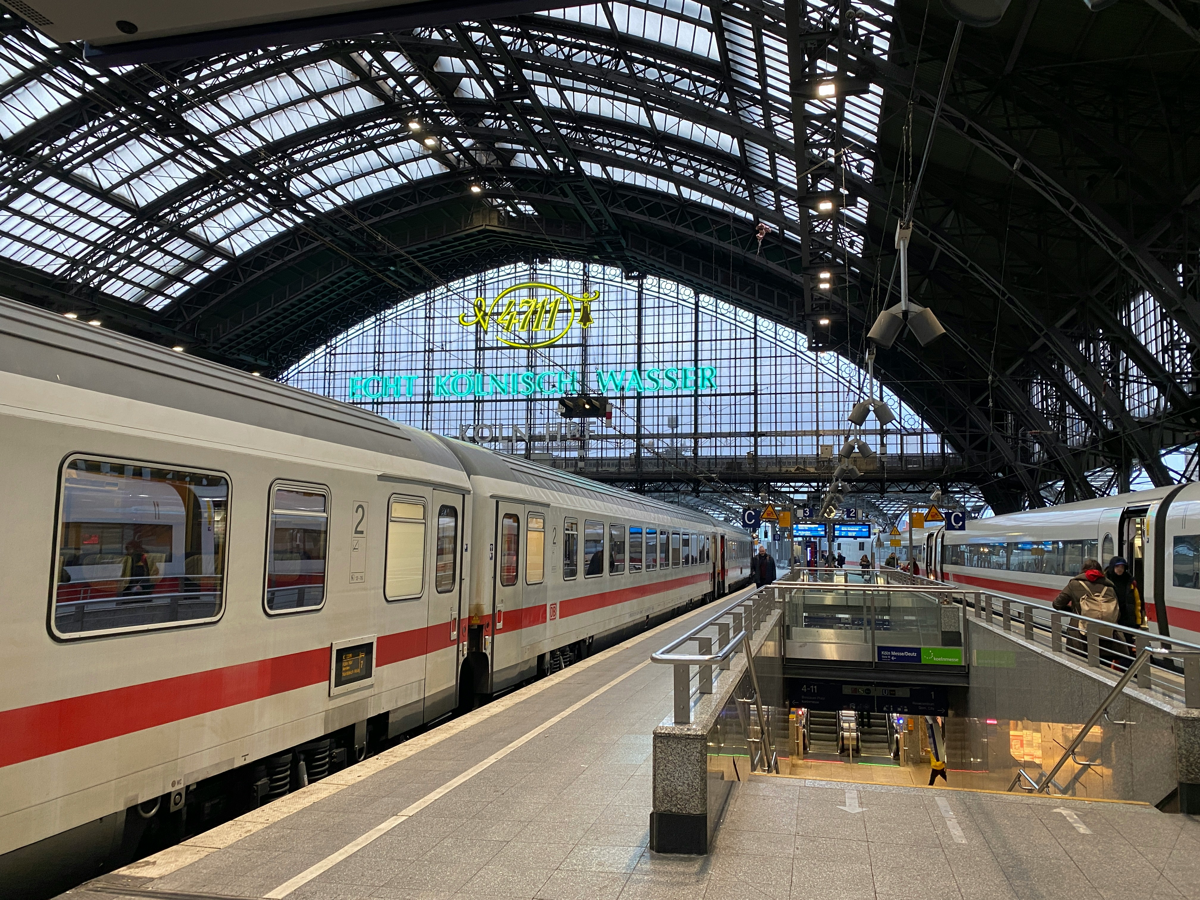 An illustrative photo of a train station with two trains parked next to each other