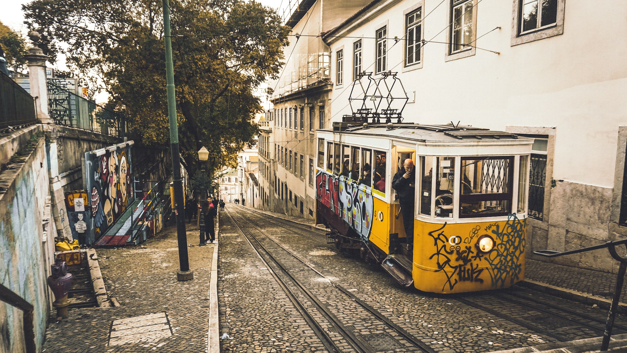 An illustrative photo of a tram on a railway road.