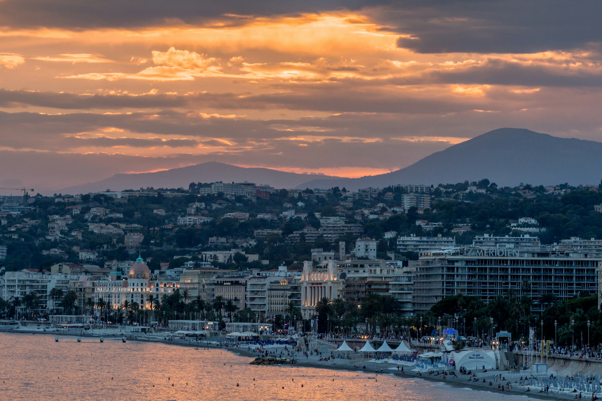 An illustrative photo of city beside body of water.