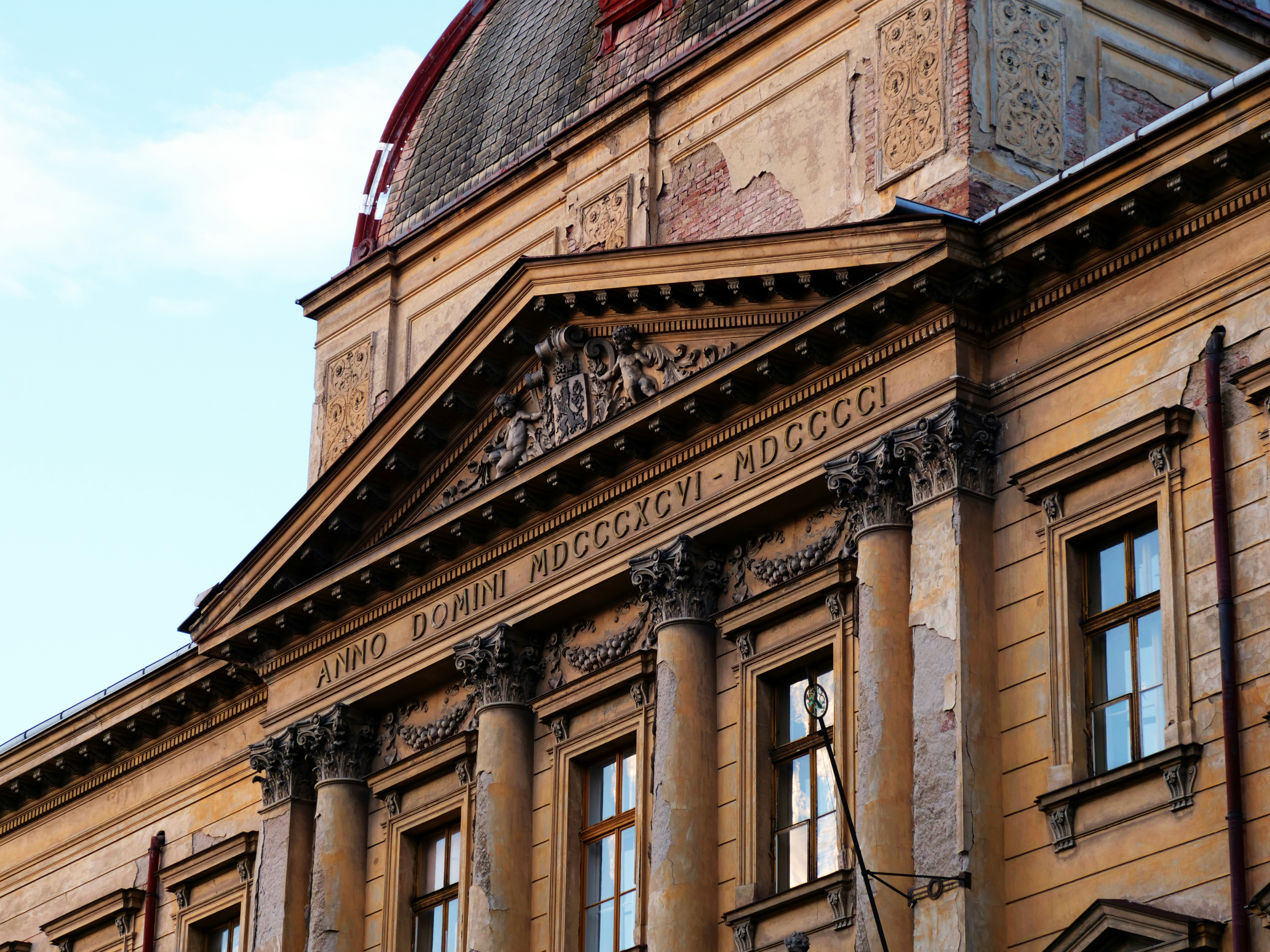 An illustrative photo of a building with sculptures on it