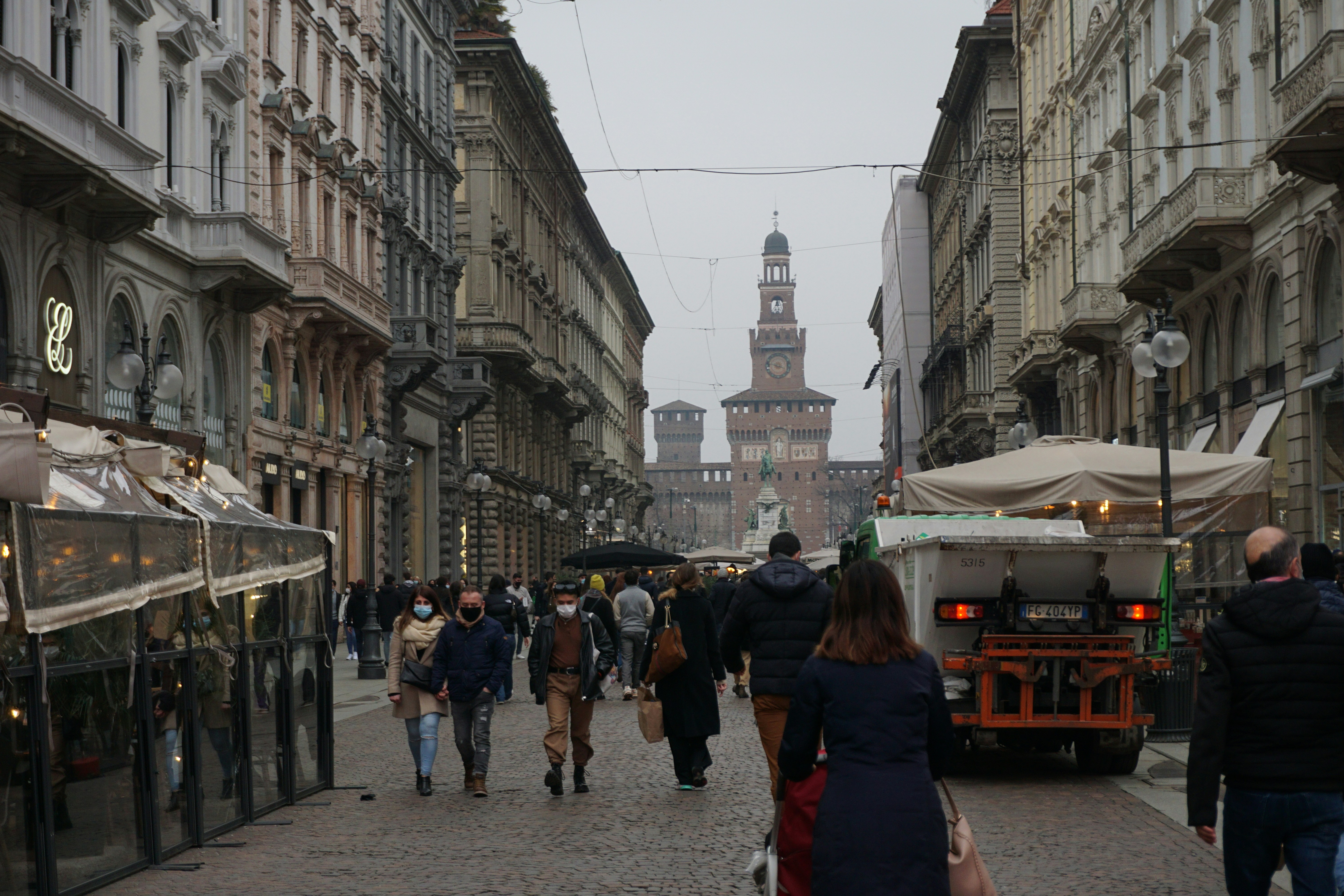 Photo by Unsplash An illustrative photo of people walking on a street during cloudy weather
