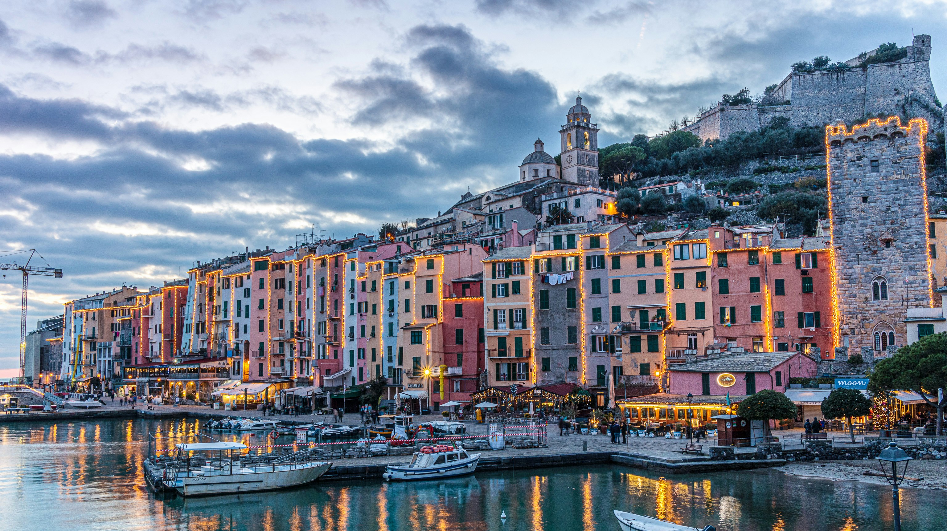 An illustrative photo of boats on water near buildings