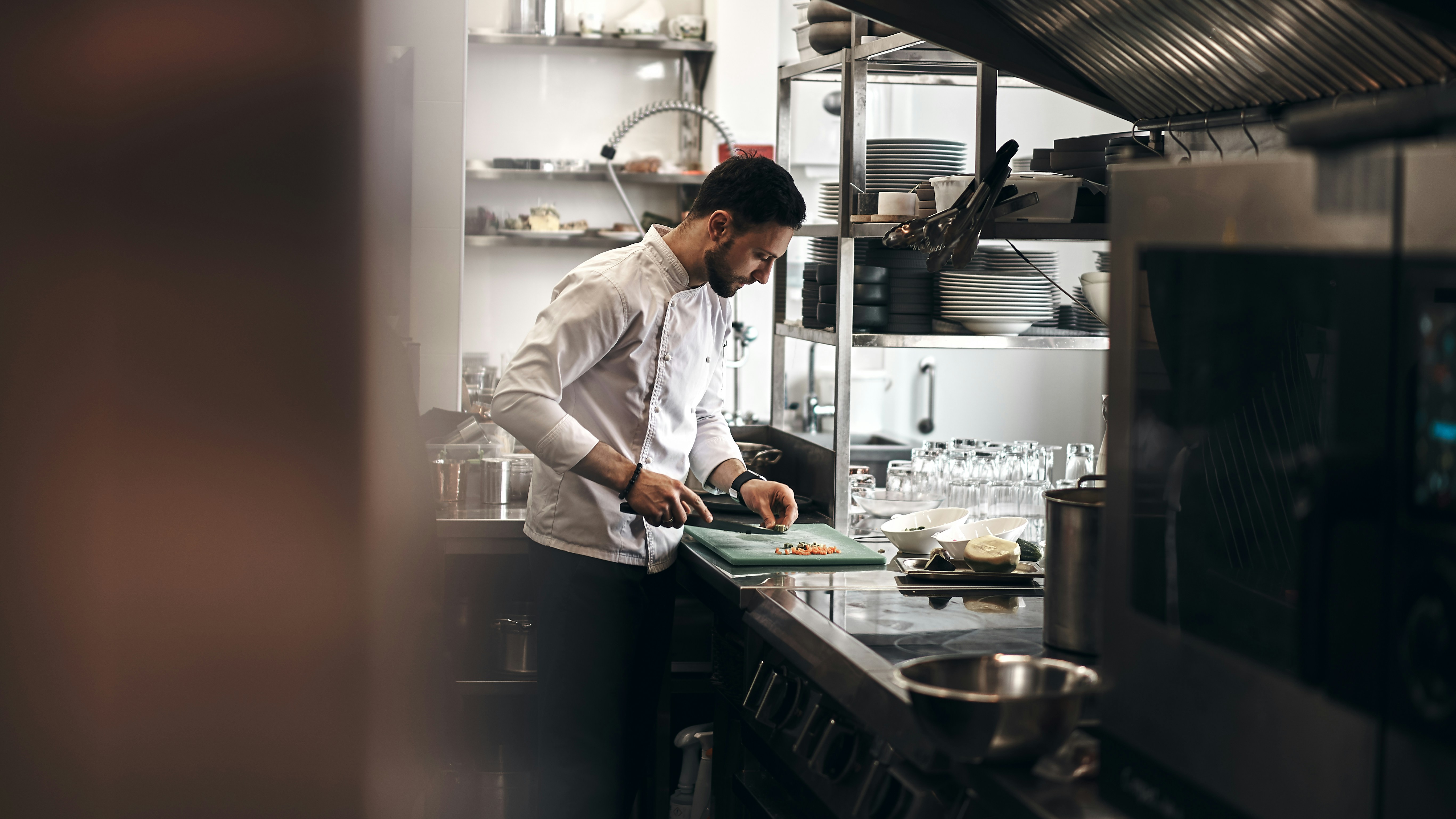 An illustrative photo of a chef cooking on a restaurant kitchen