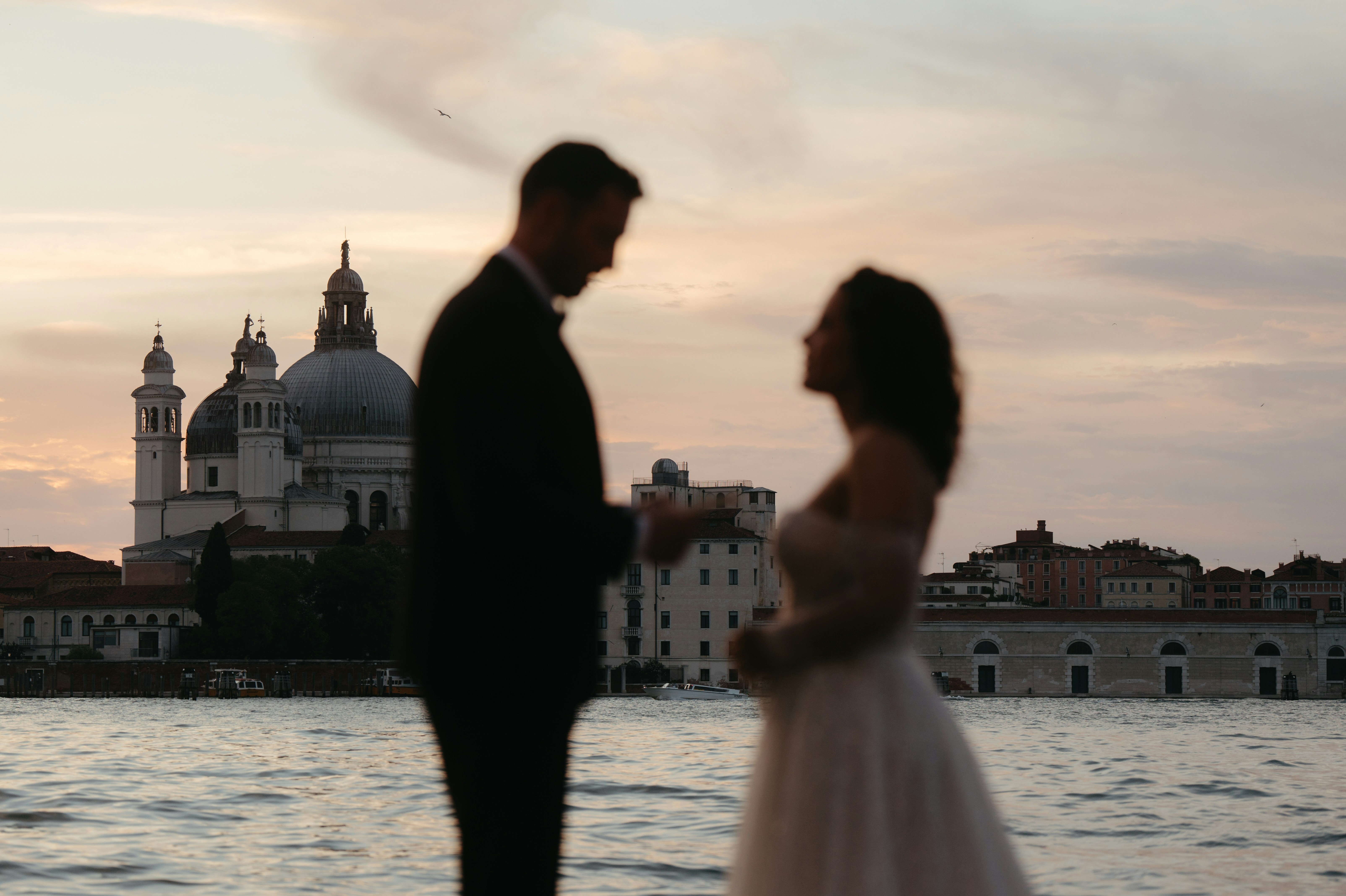 Photo by Unsplash An illustrative photo of a couple in Venice during sunset