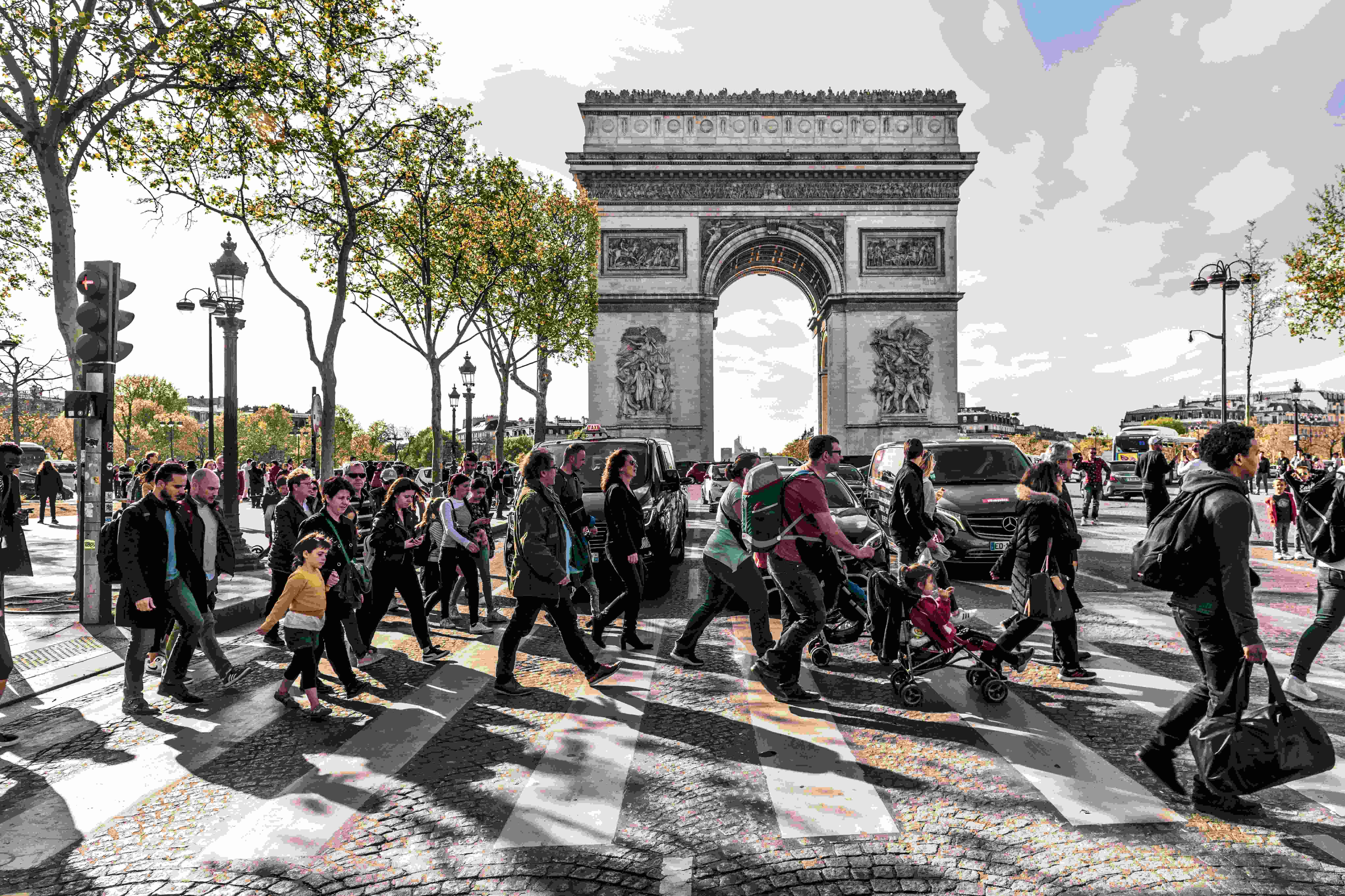 Image by Unsplash An illustrative photo of people crossing a street in Paris.