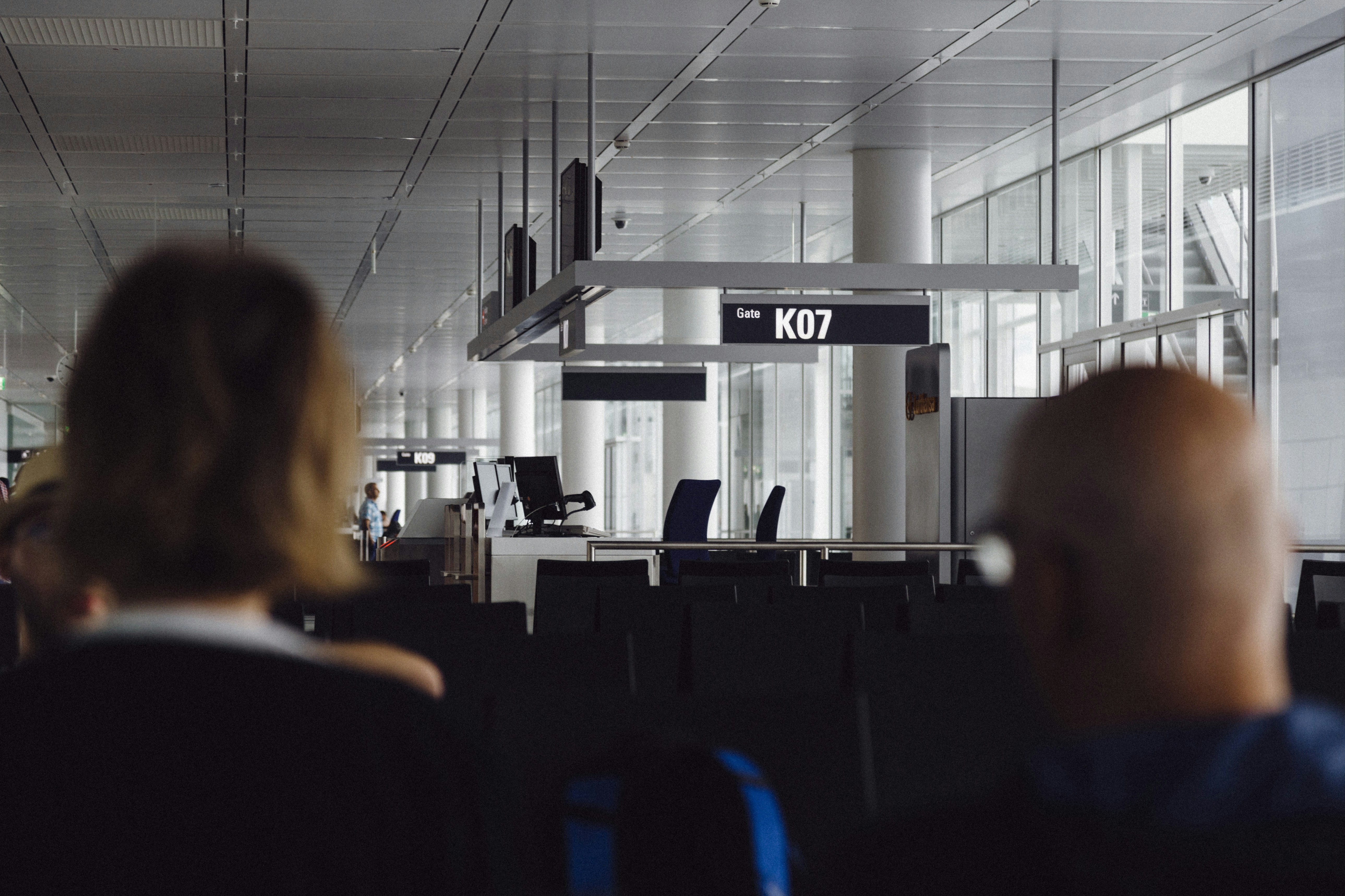 An illustrative photo of people sitting in the airport.