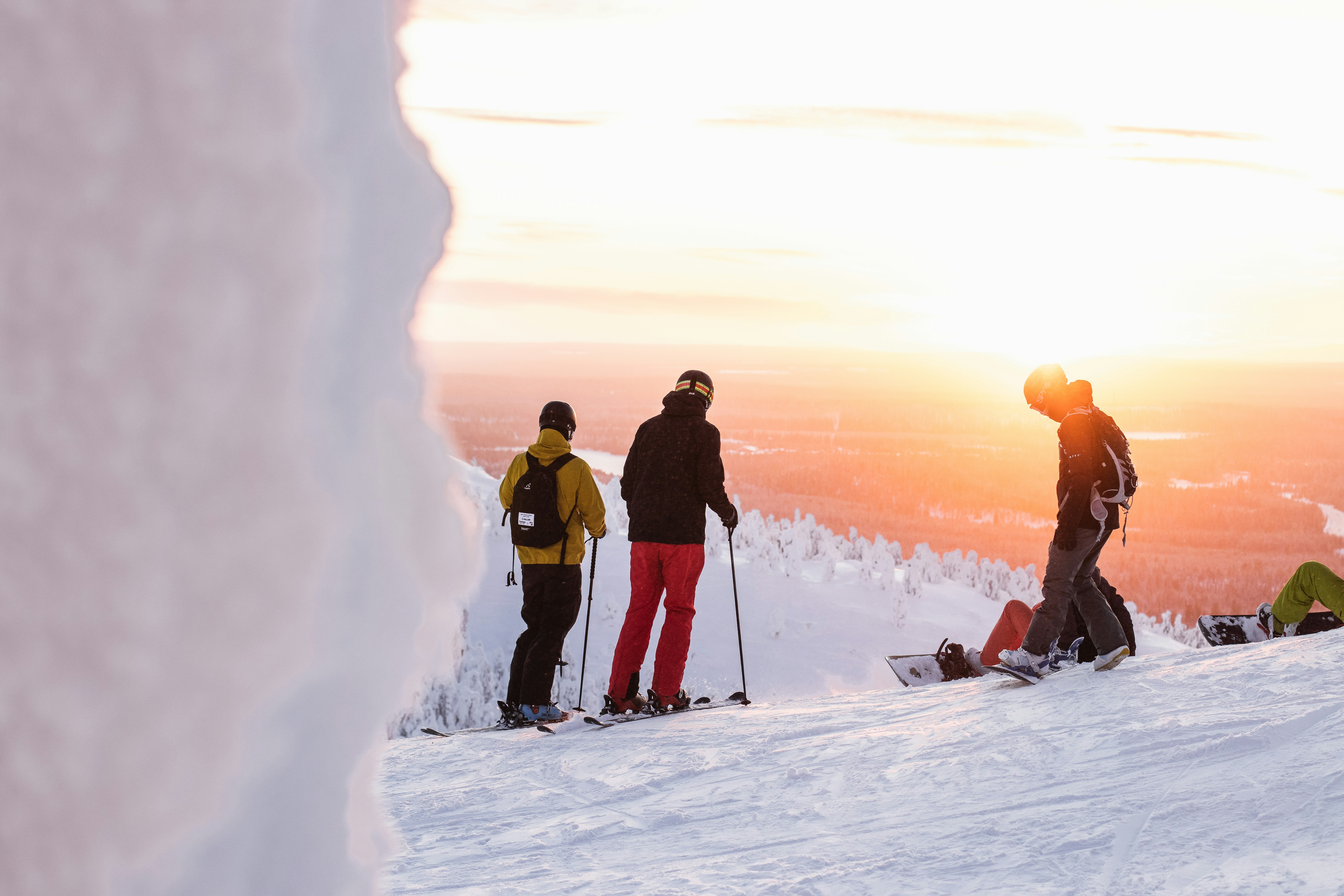 An illustrative photo of people skiing on a snow-covered mountain.
