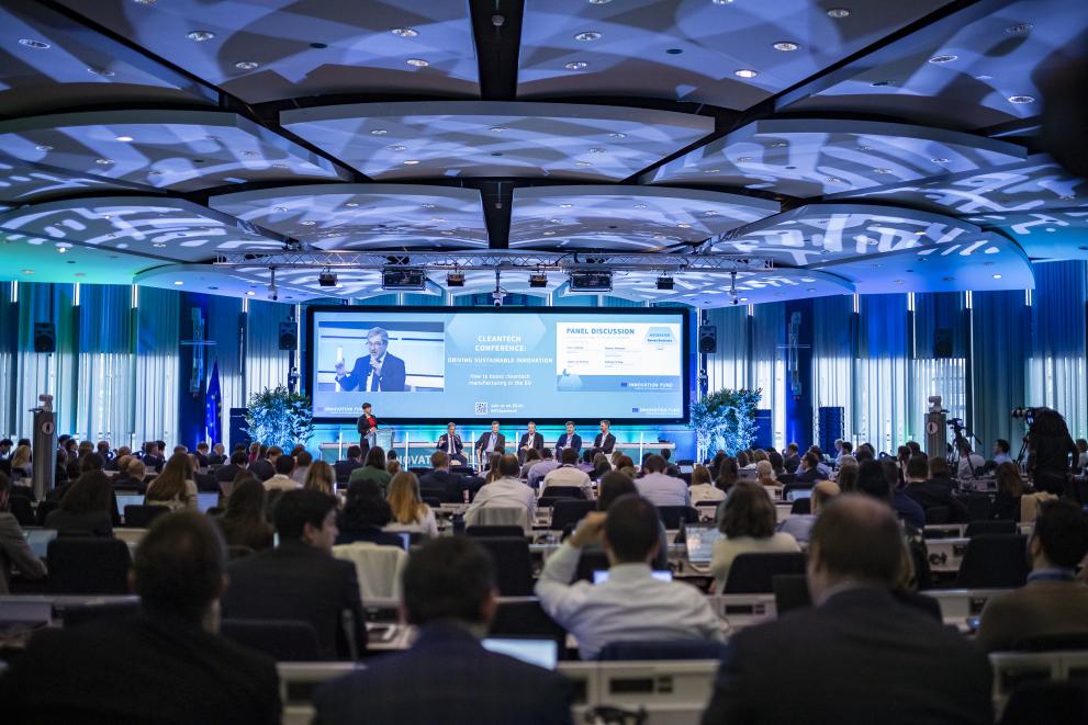 A photo presenting a cleantech conference panel discussion.