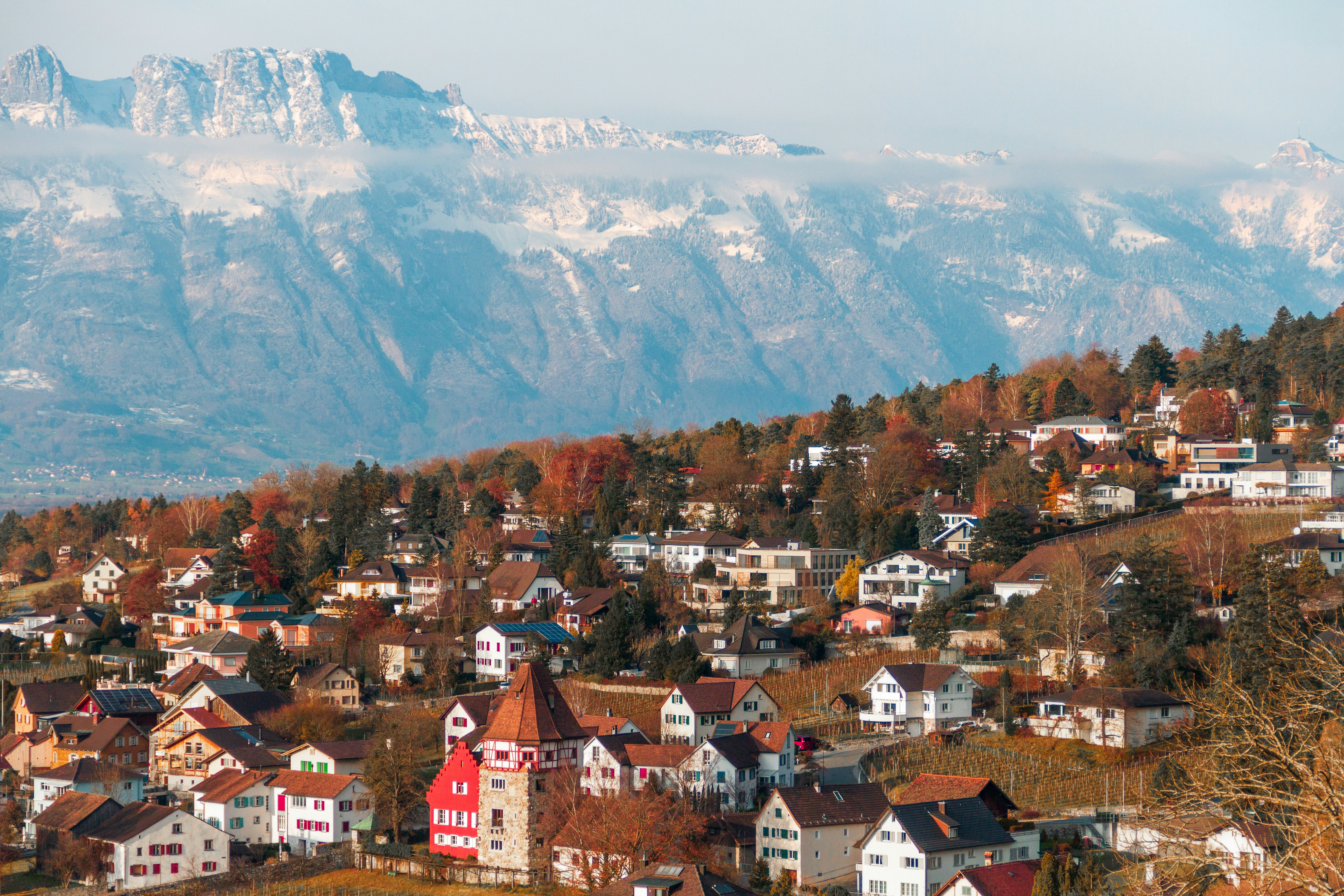 Image by Unsplash An illustrative photo of a town in front of a mountain.