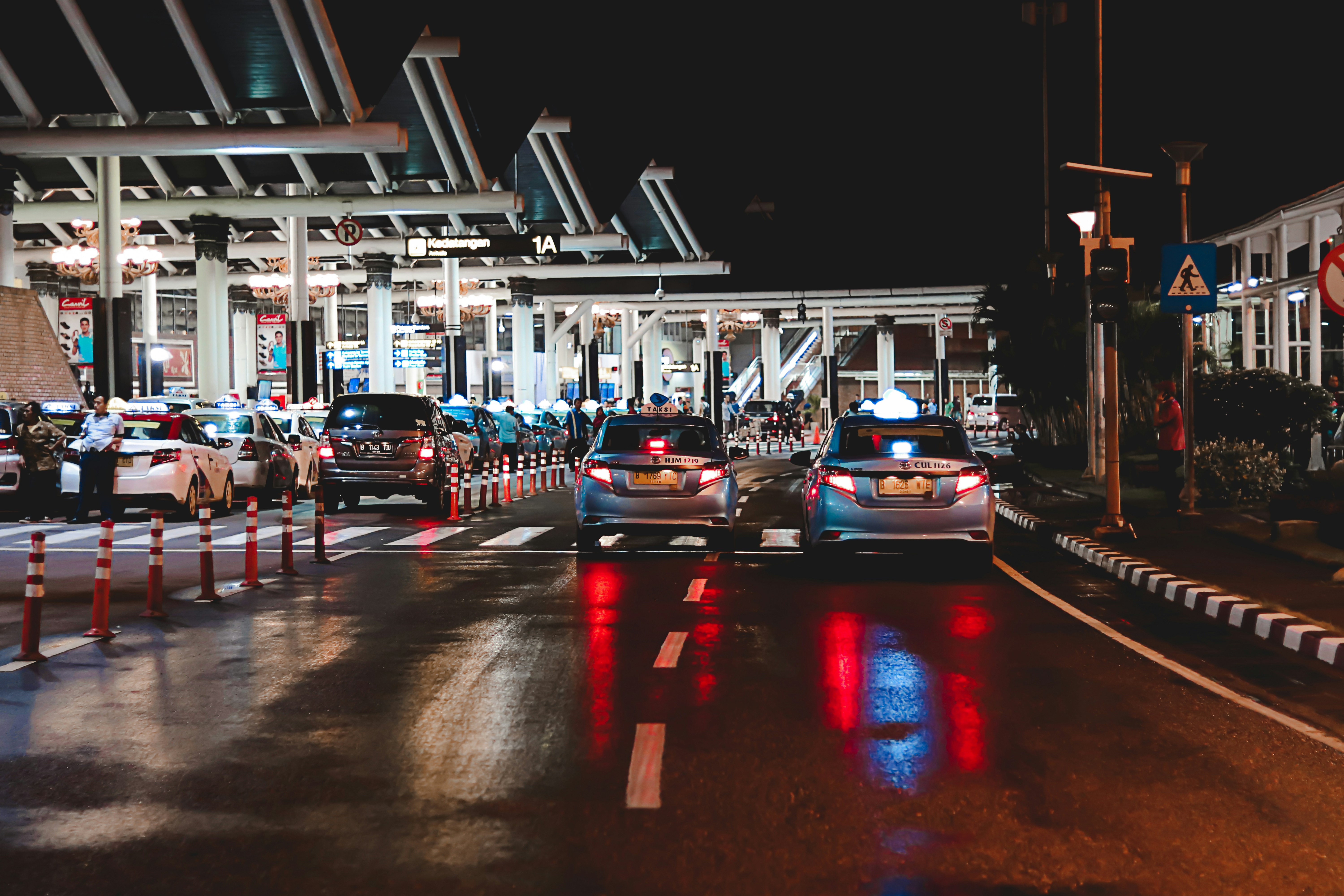 An illustrative photo of cars on road on the boarder during night.