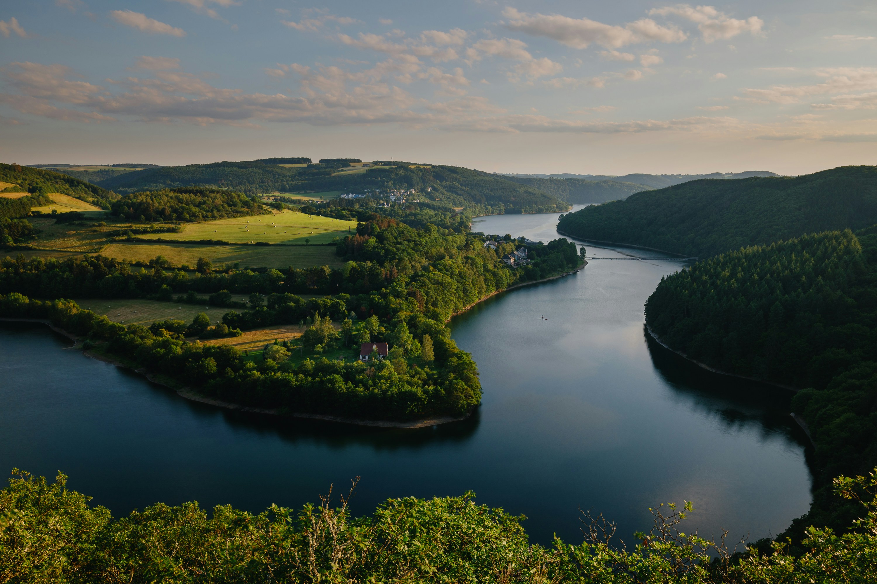 Photo by Unsplash An illustrative photo of a river running through the valley.