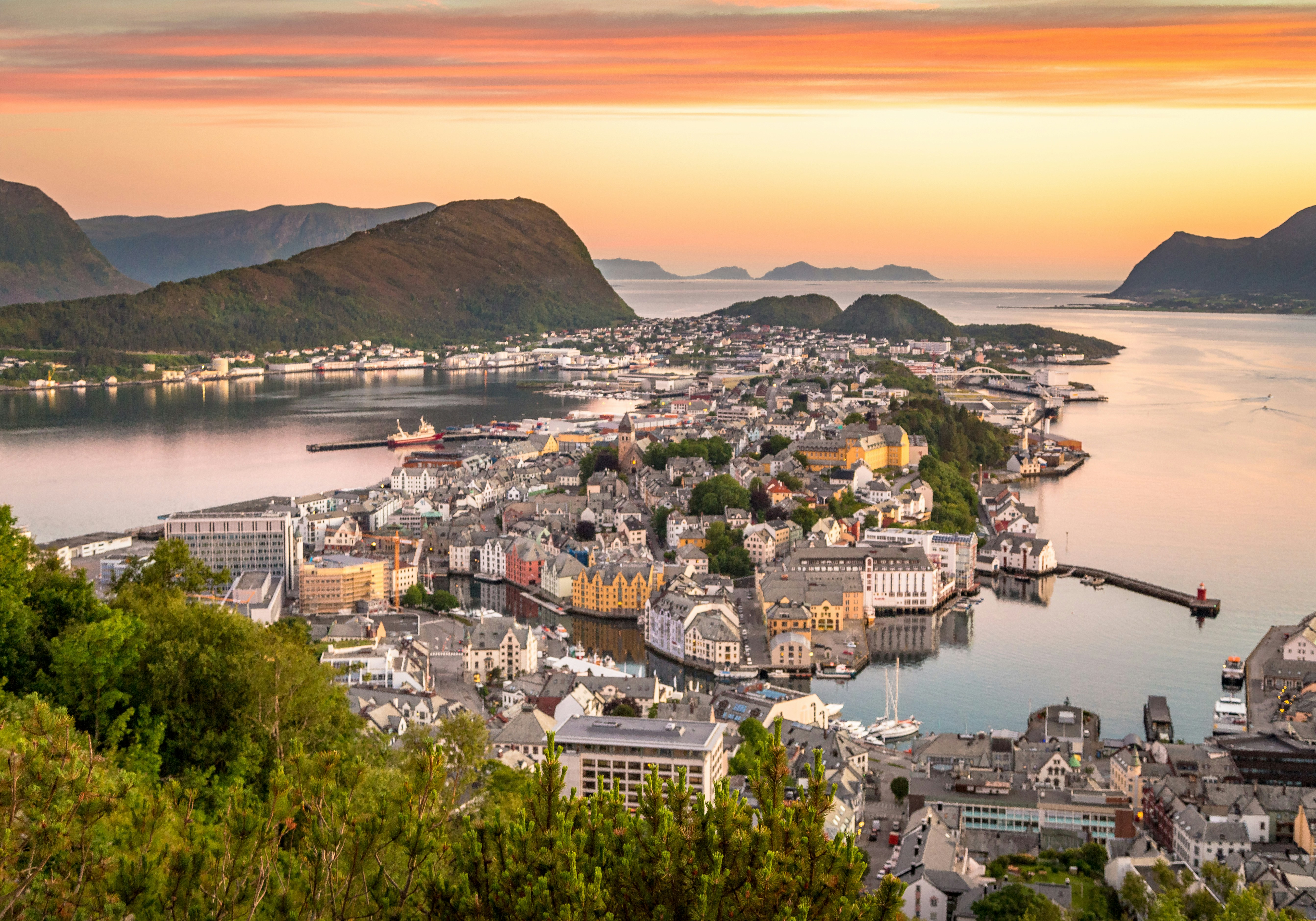 Photo by Unsplash An illustrative photo of houses on an island in a body of water.