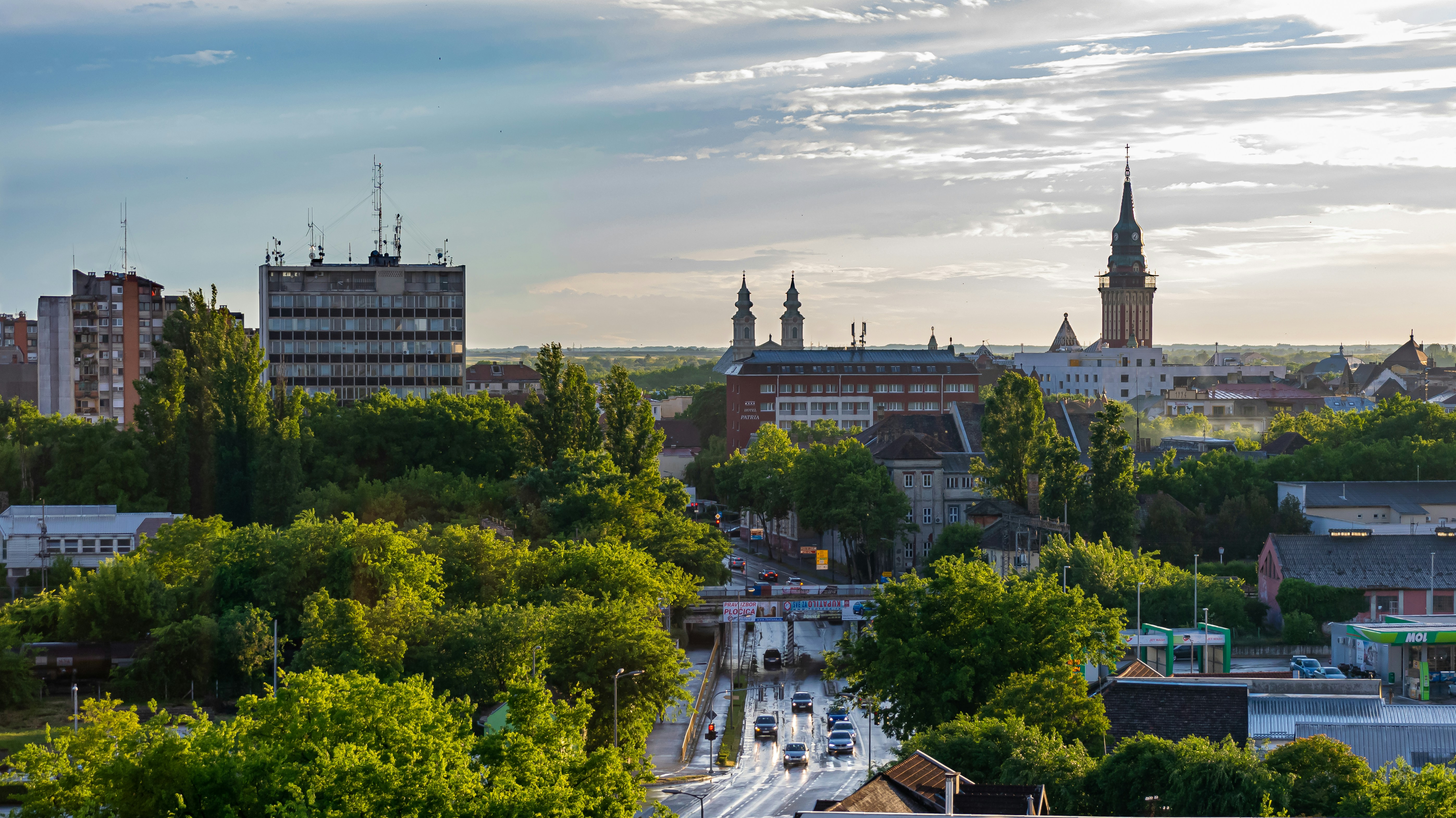 Photo by Unsplash An illustrative photo of a city with green trees.