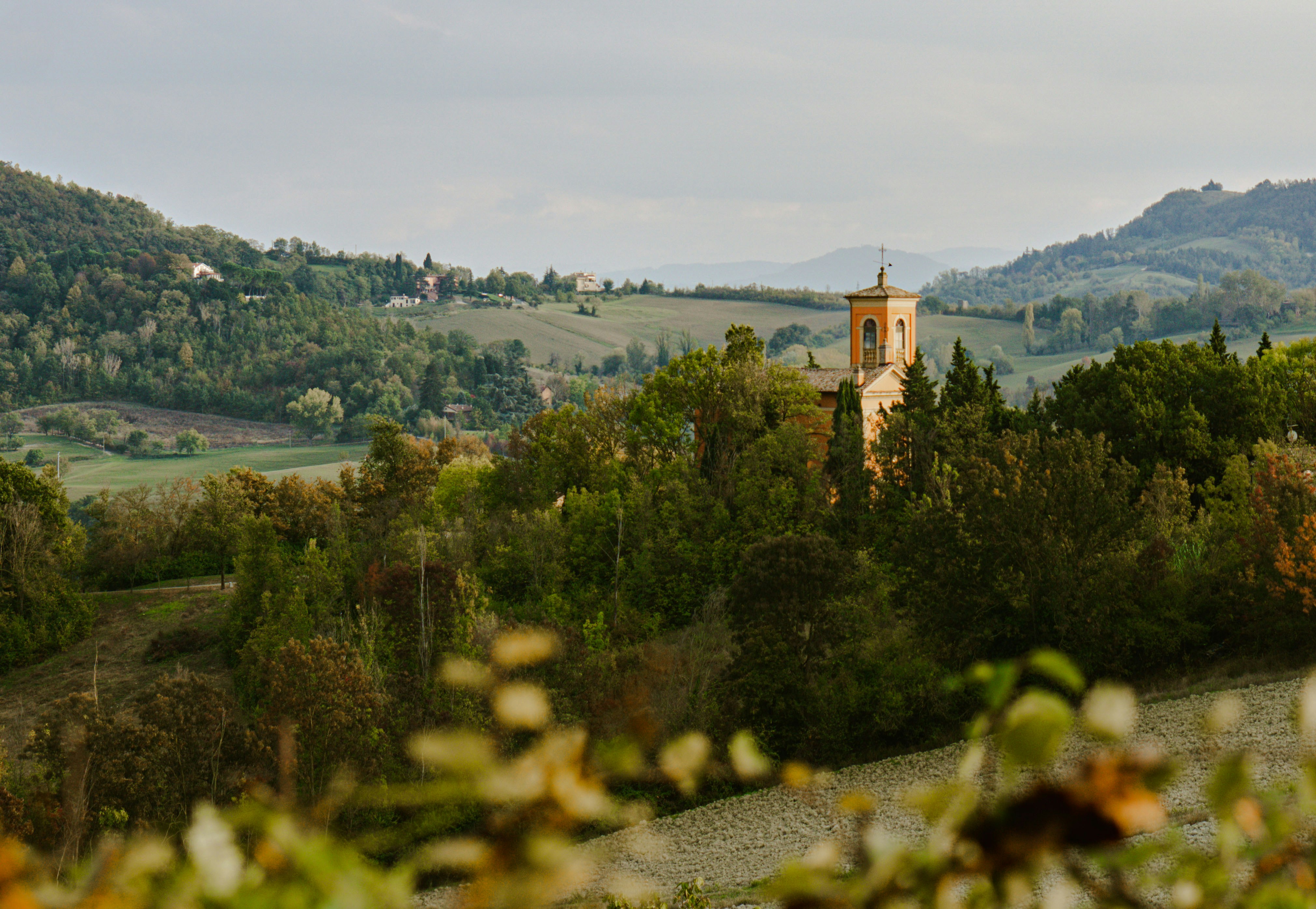 An illustrative photo of a yellow church in the background.