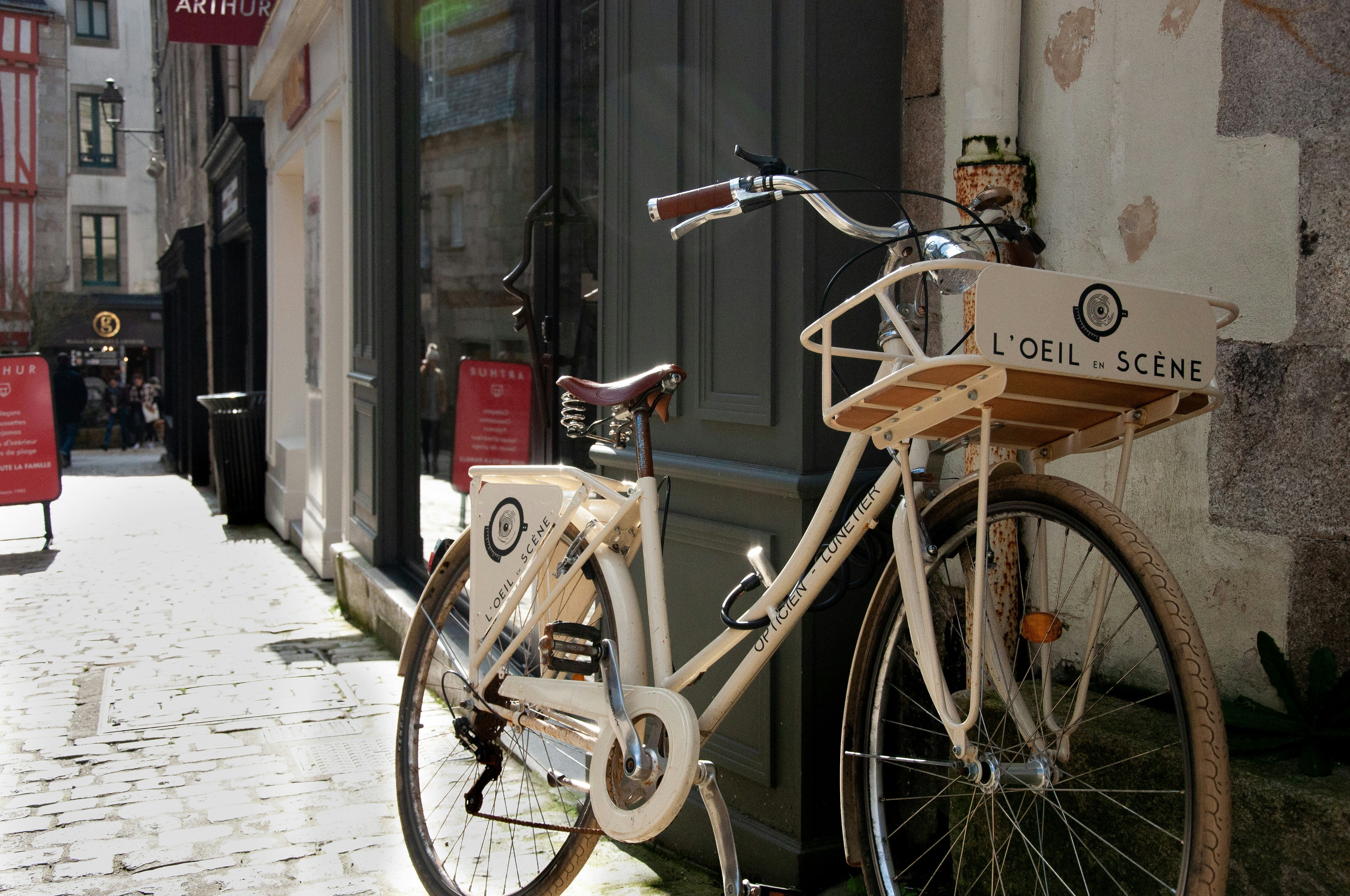 Photo by Unsplash An illustrative photo of a brown city bike parked beside a building.