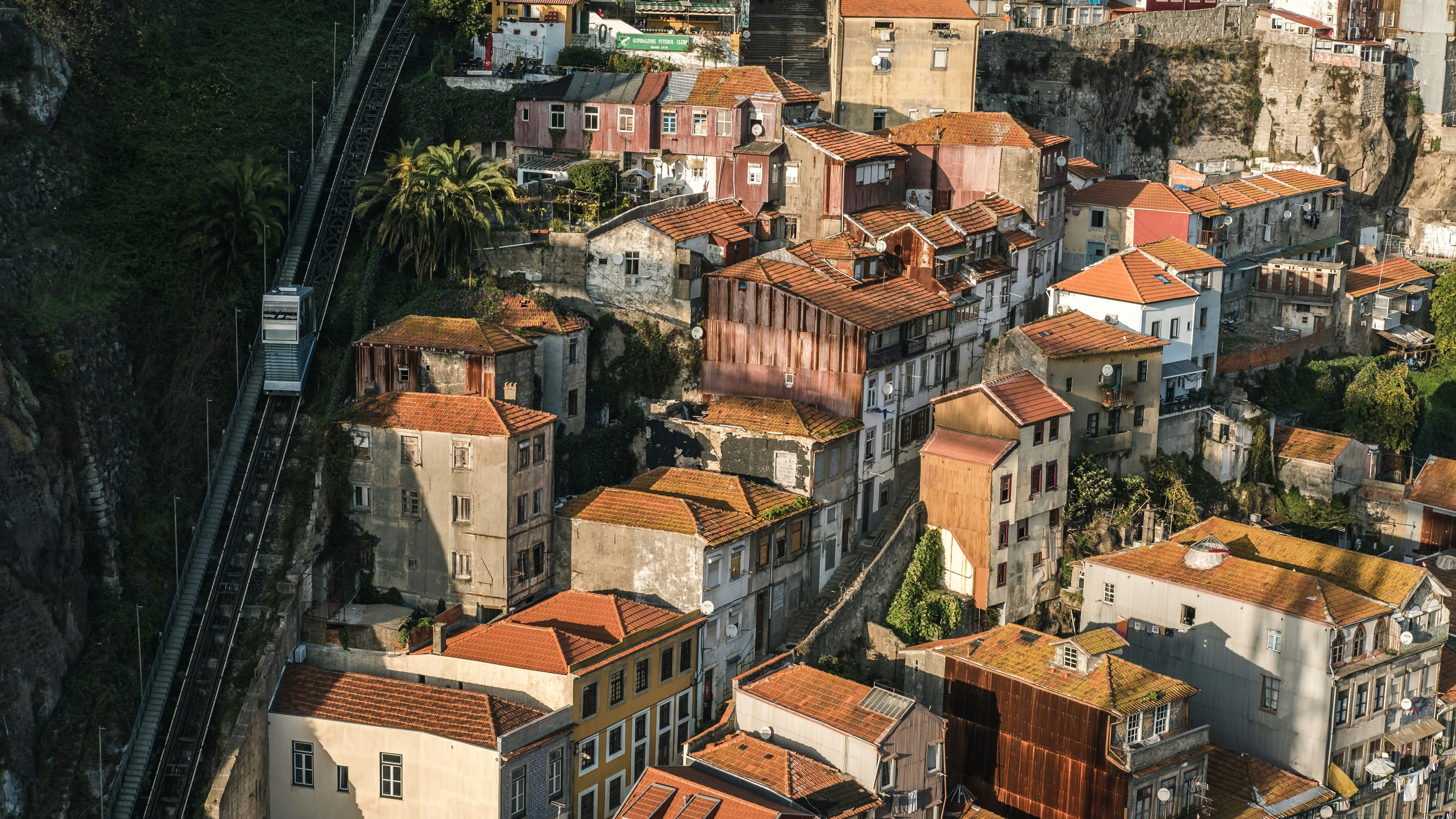 Photo by Unsplash An illustrative photo of white houses on a hill.