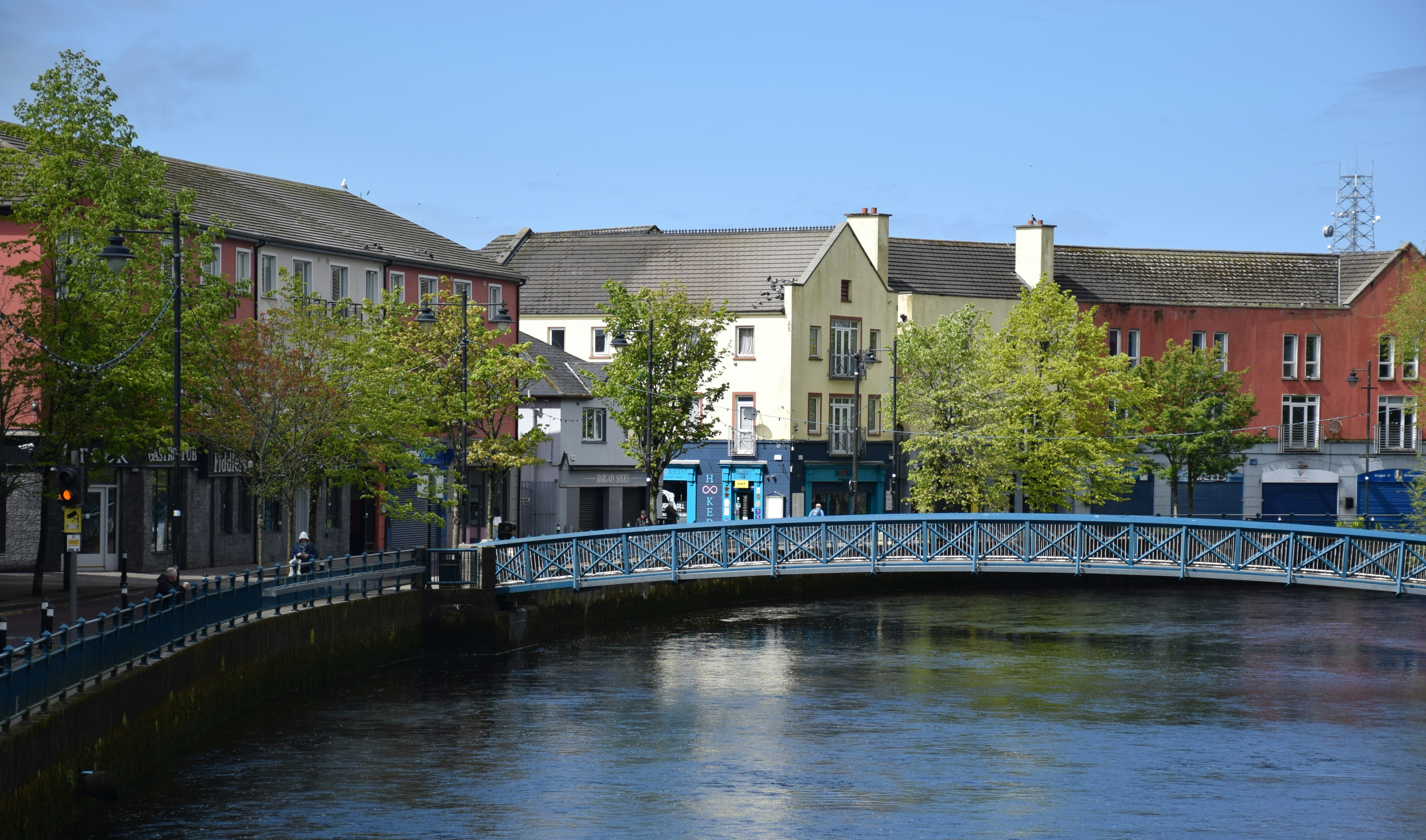 Photo by Unsplash An illustrative photo of a bridge over a river in a small city.