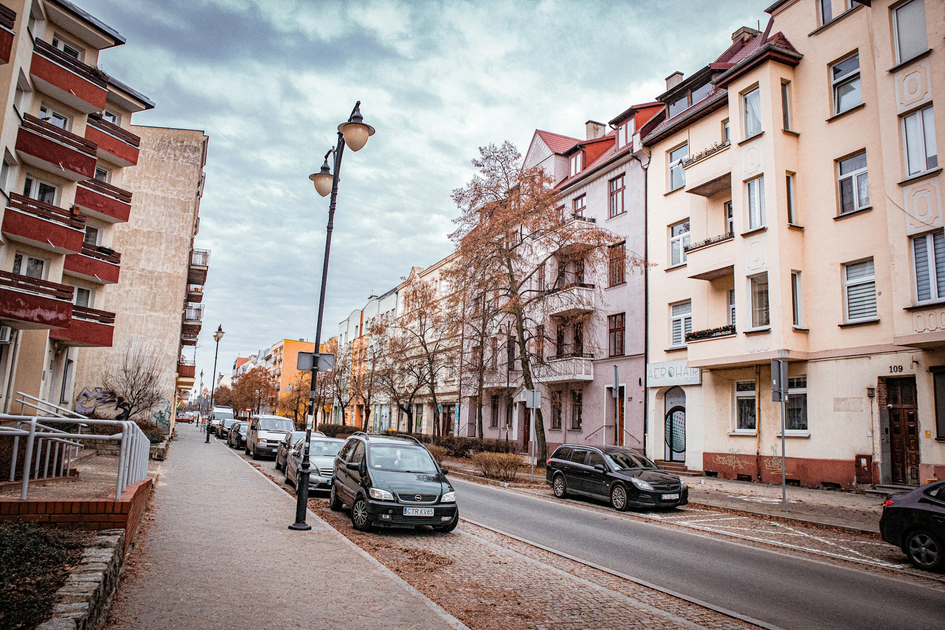 Photo by Unsplash An illustrative photo of a person sitting on a bench in front of a building