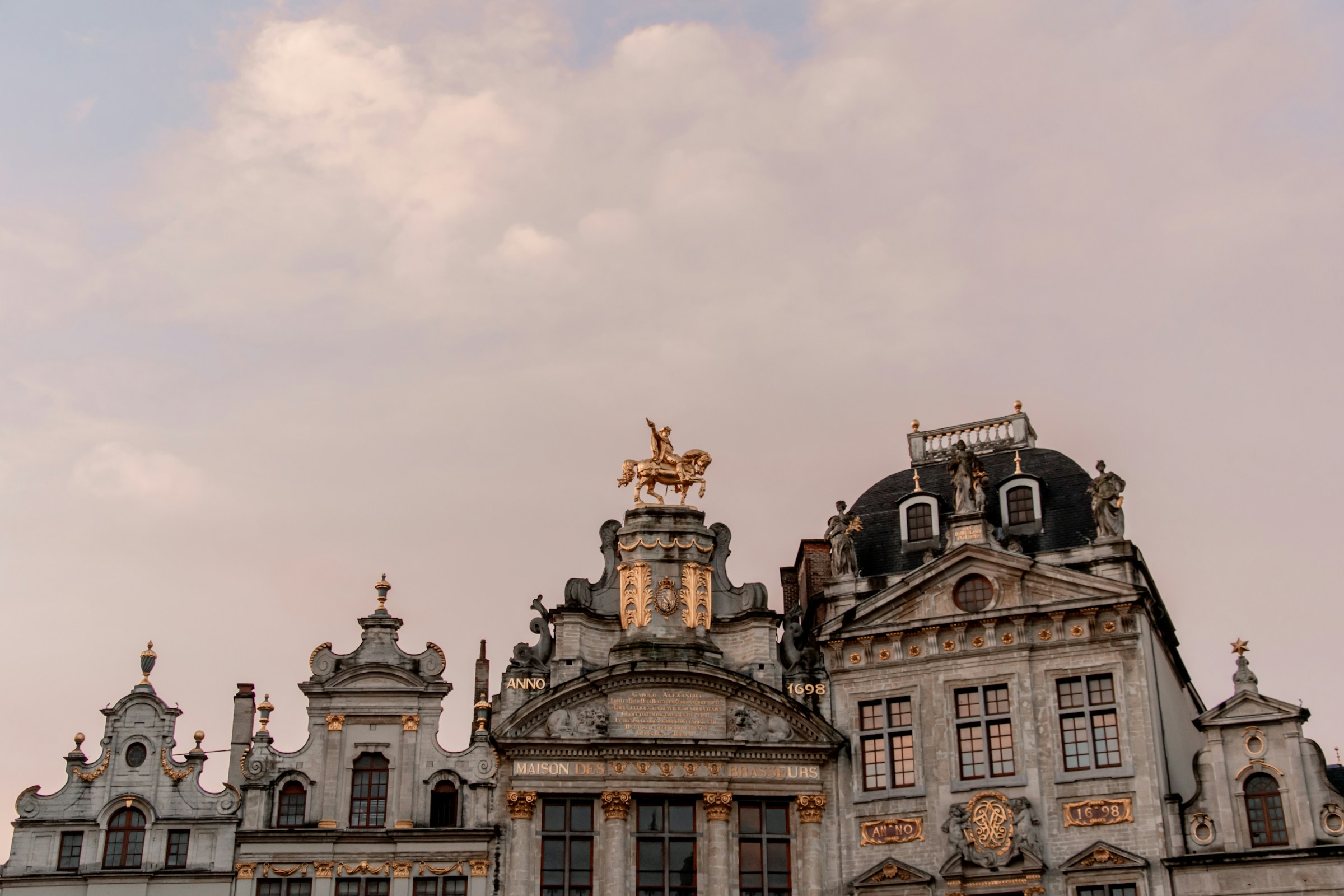 Photo by Unsplash An illustrative photo of a large building with a statue on top.