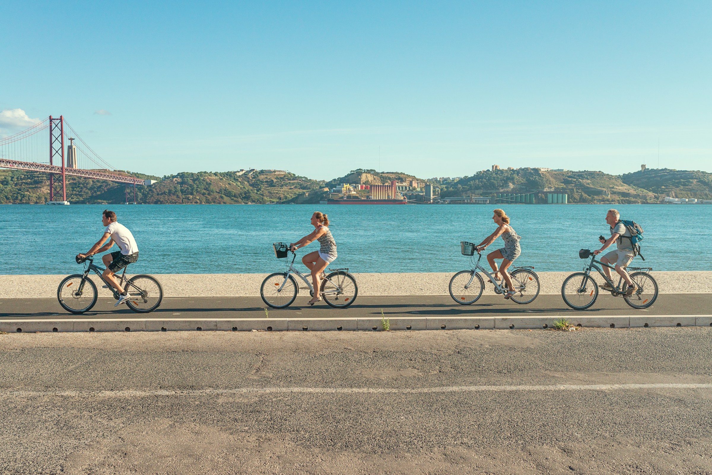 Photo by Unsplash An illustrative photo of people riding bicycles on the road.