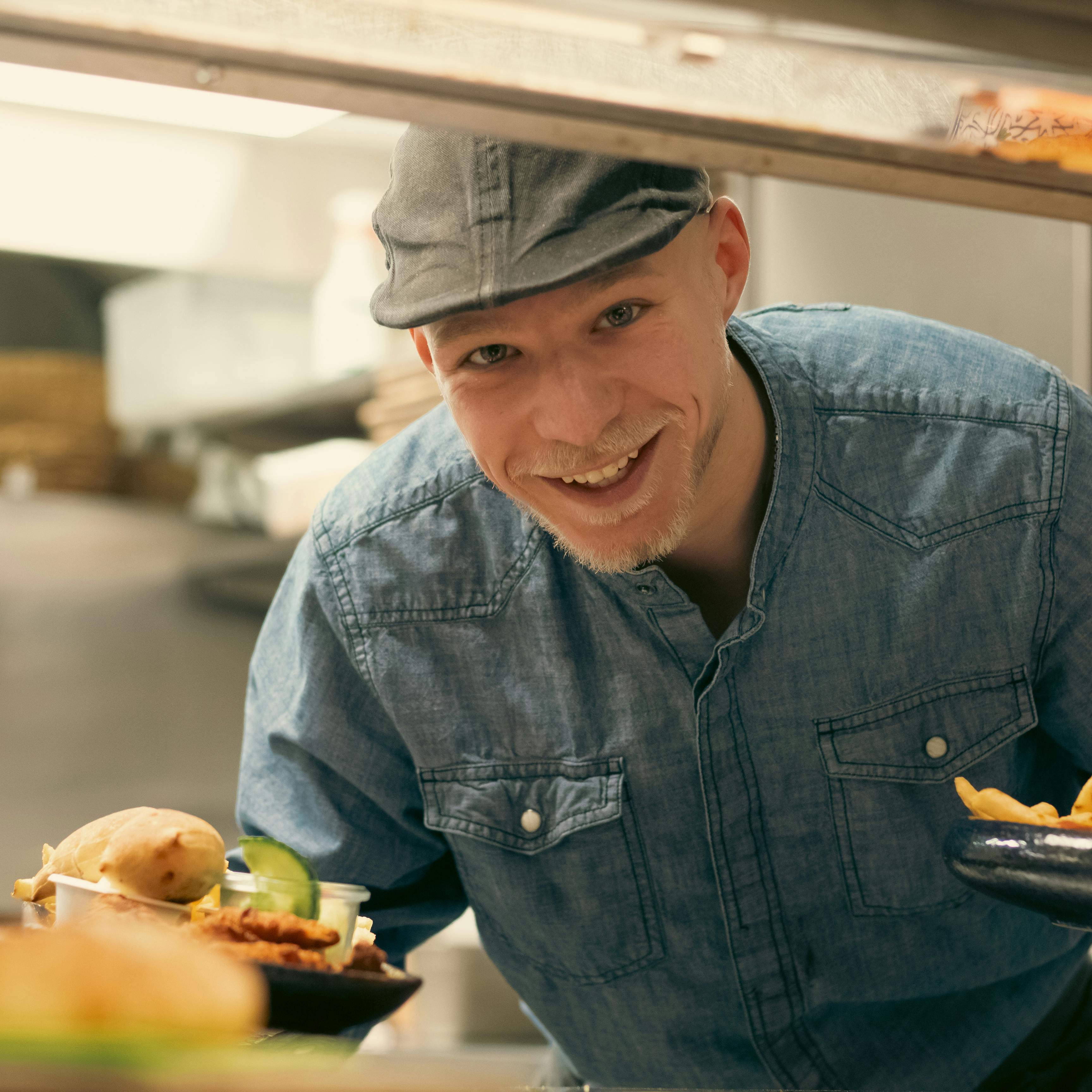 An illustrative photo of a man delivering food.