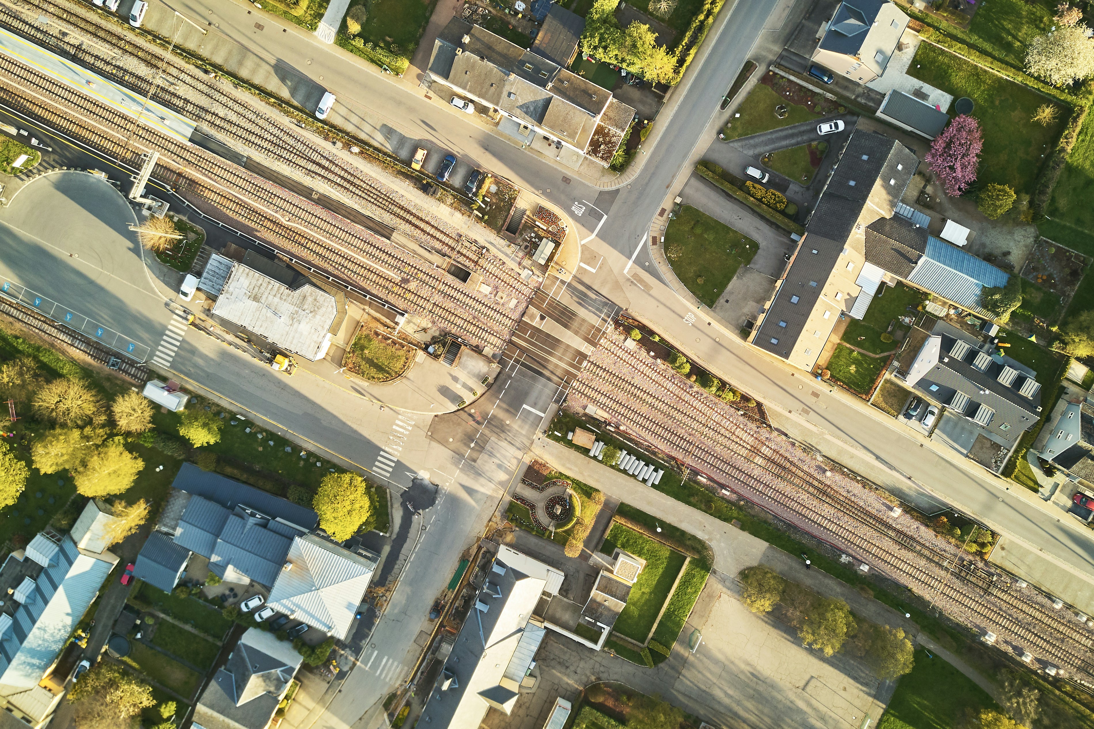 An illustrative photo of railway between houses.