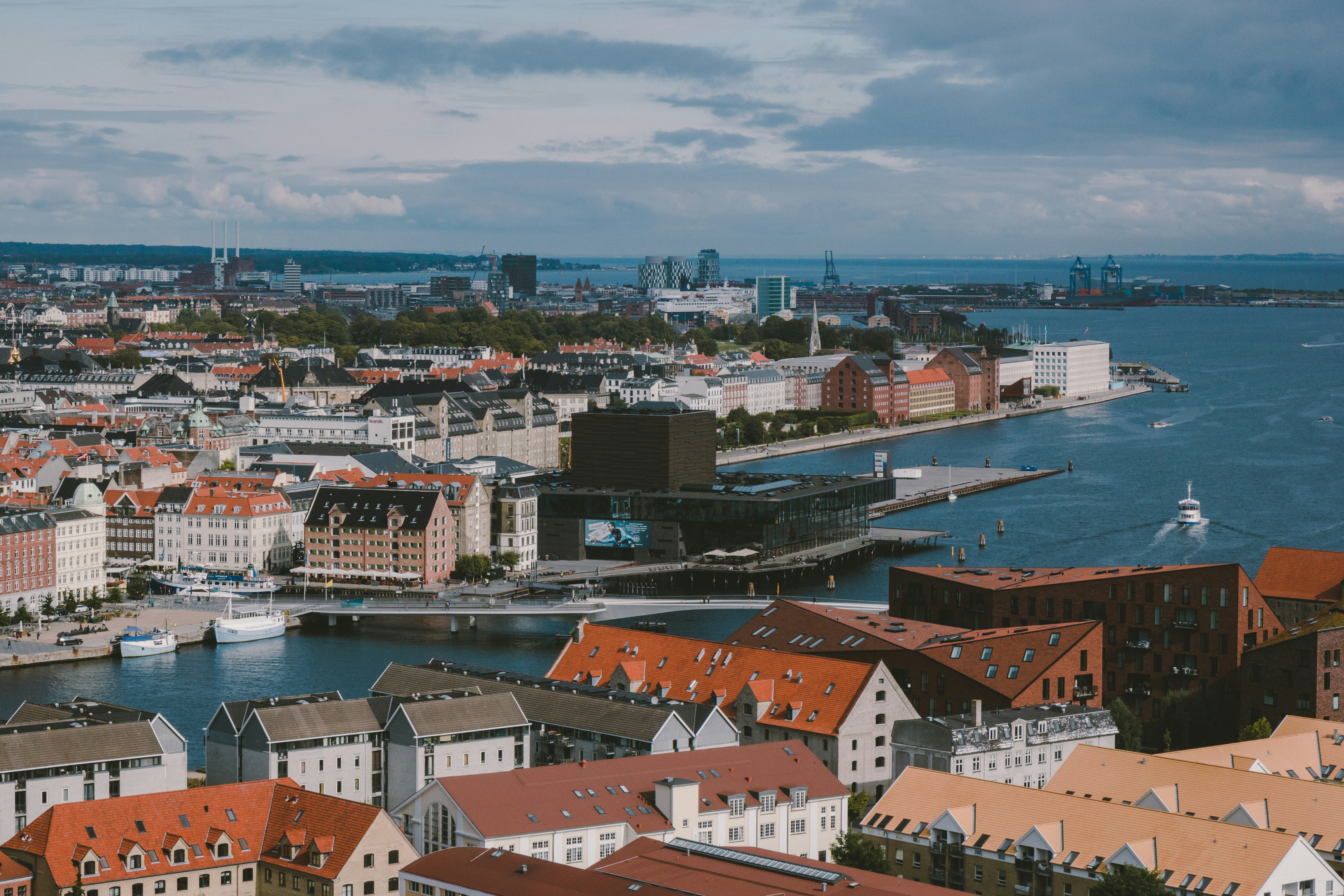 Photo by Unsplash An illustrative photo of city buildings near a body of water.