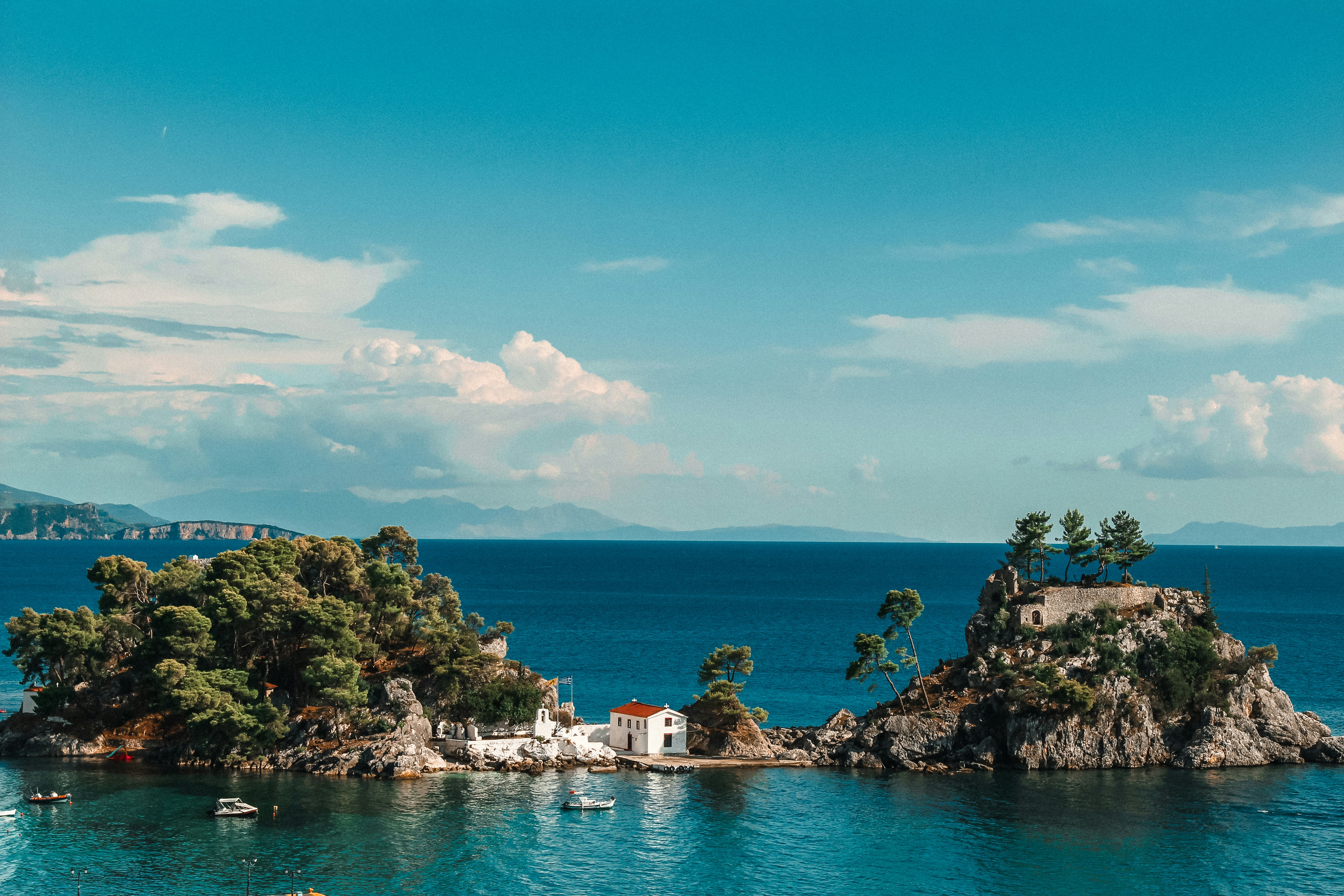 An illustrative photo of a small island in the middle of a body of water.