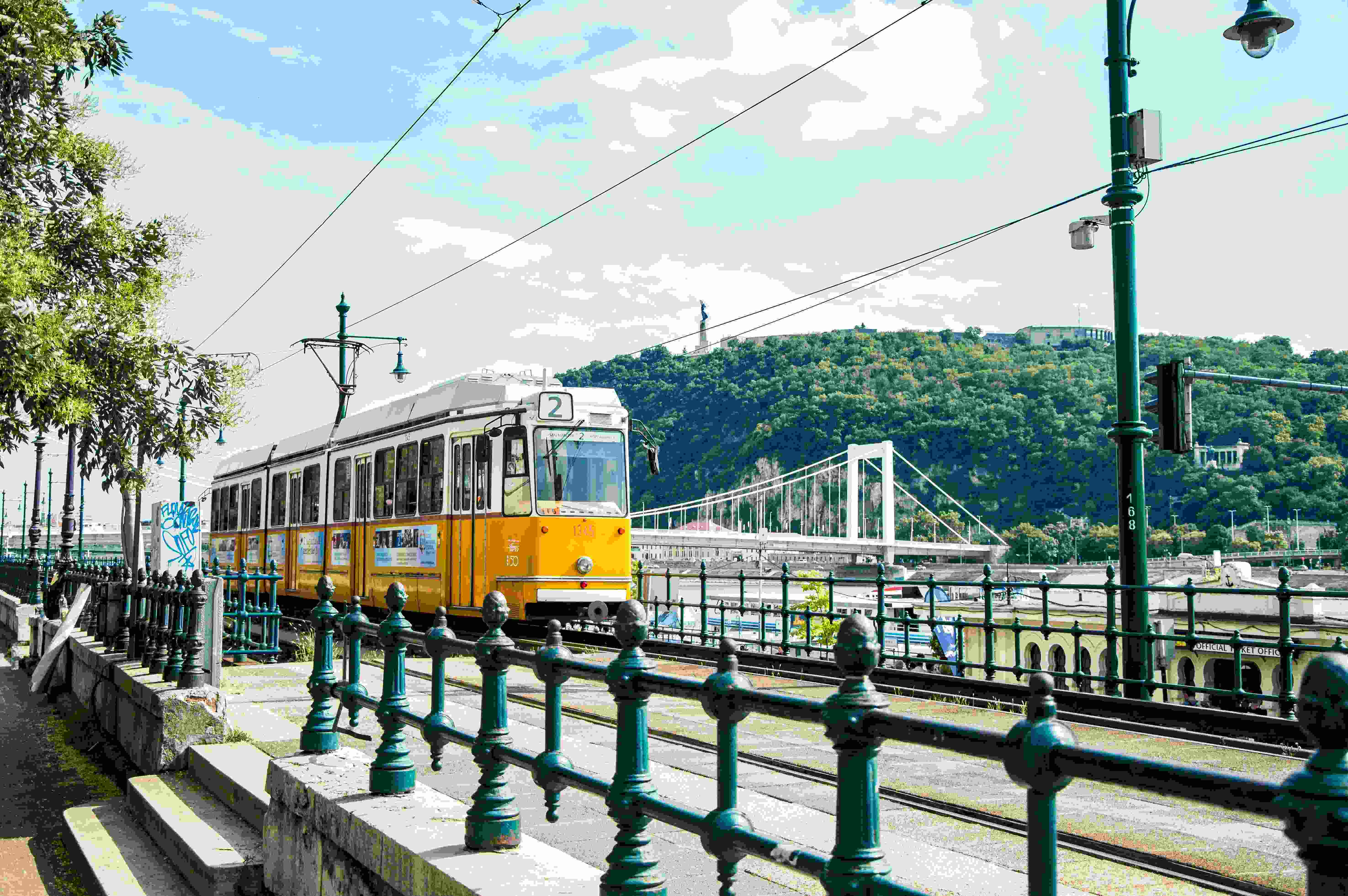 Photo by Unsplash An illustrative photo of a yellow tram on a bridge.