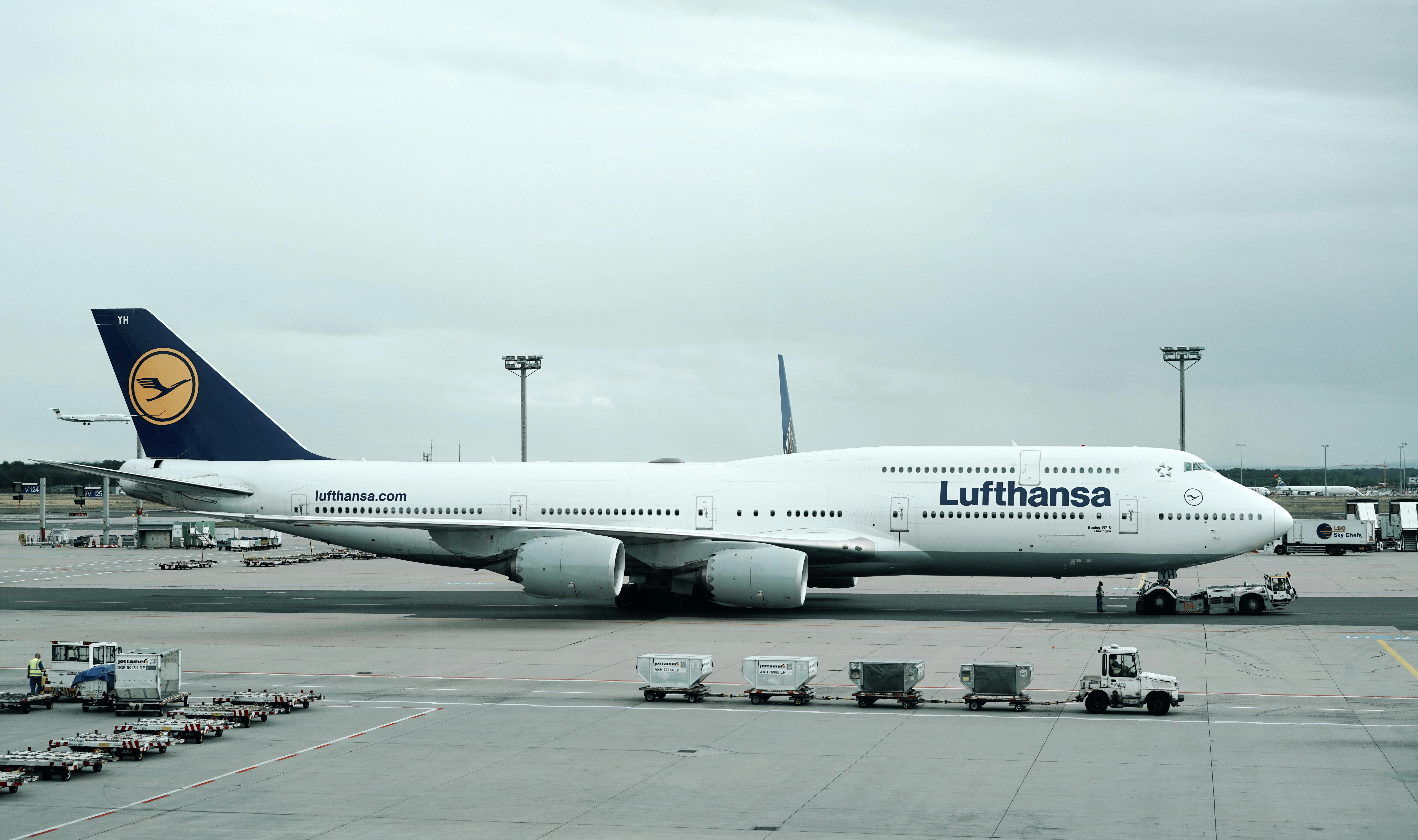 Photo by Unsplash An illustrative photo of a blue and white parked airplane.
