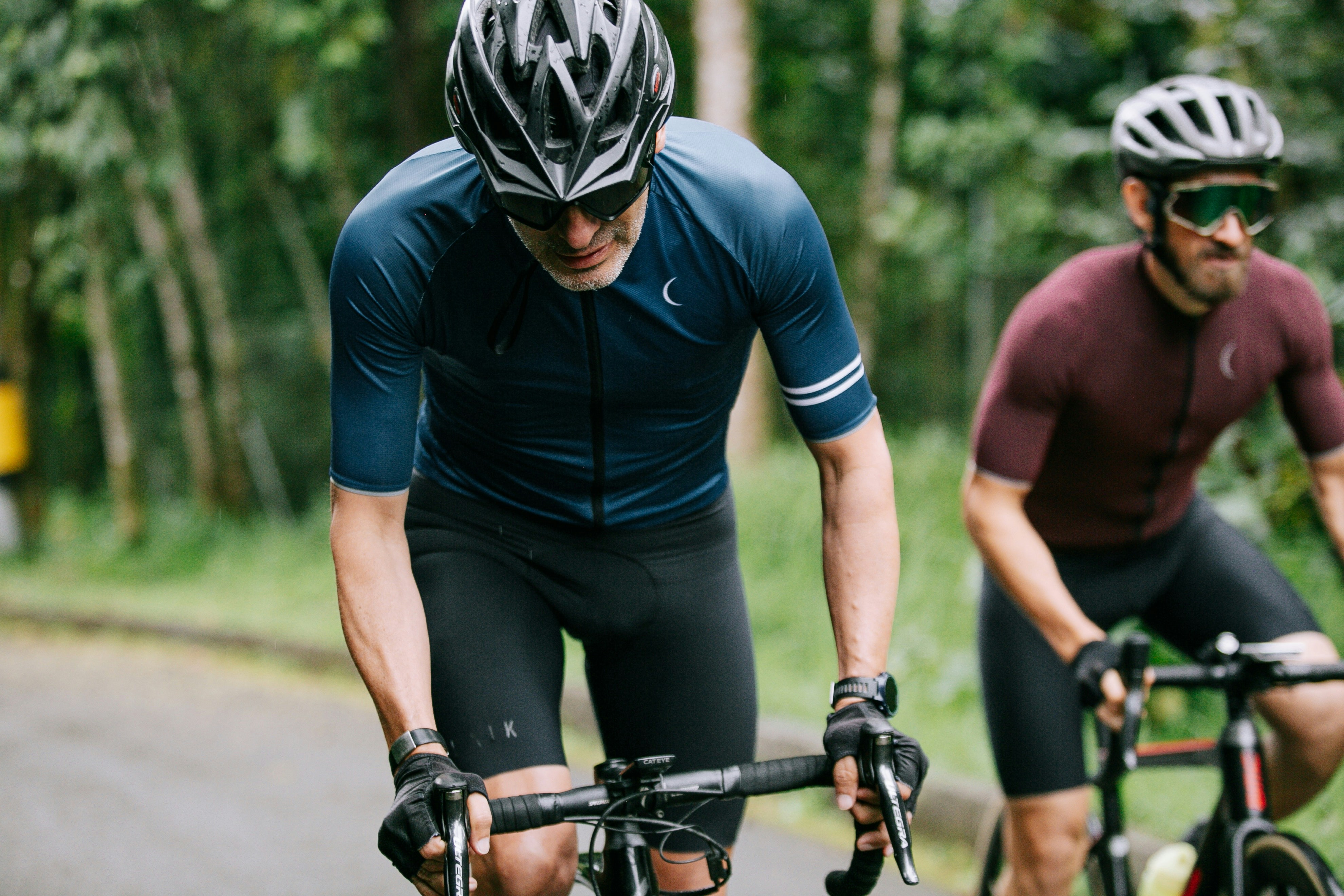 Photo by Unsplash An illustrative photo of two men cycling.