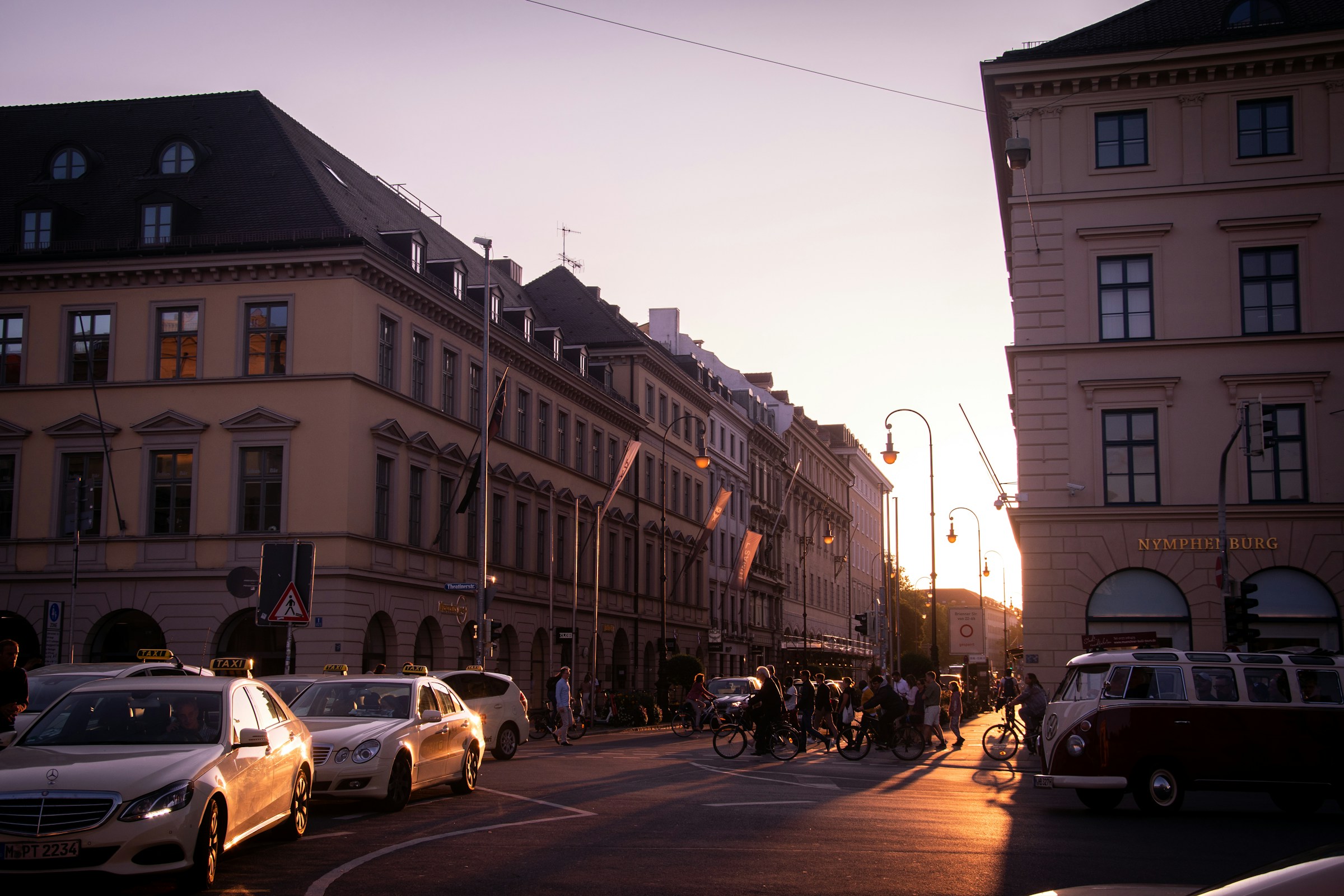 An illustrative photo of cars parked outside buildings.