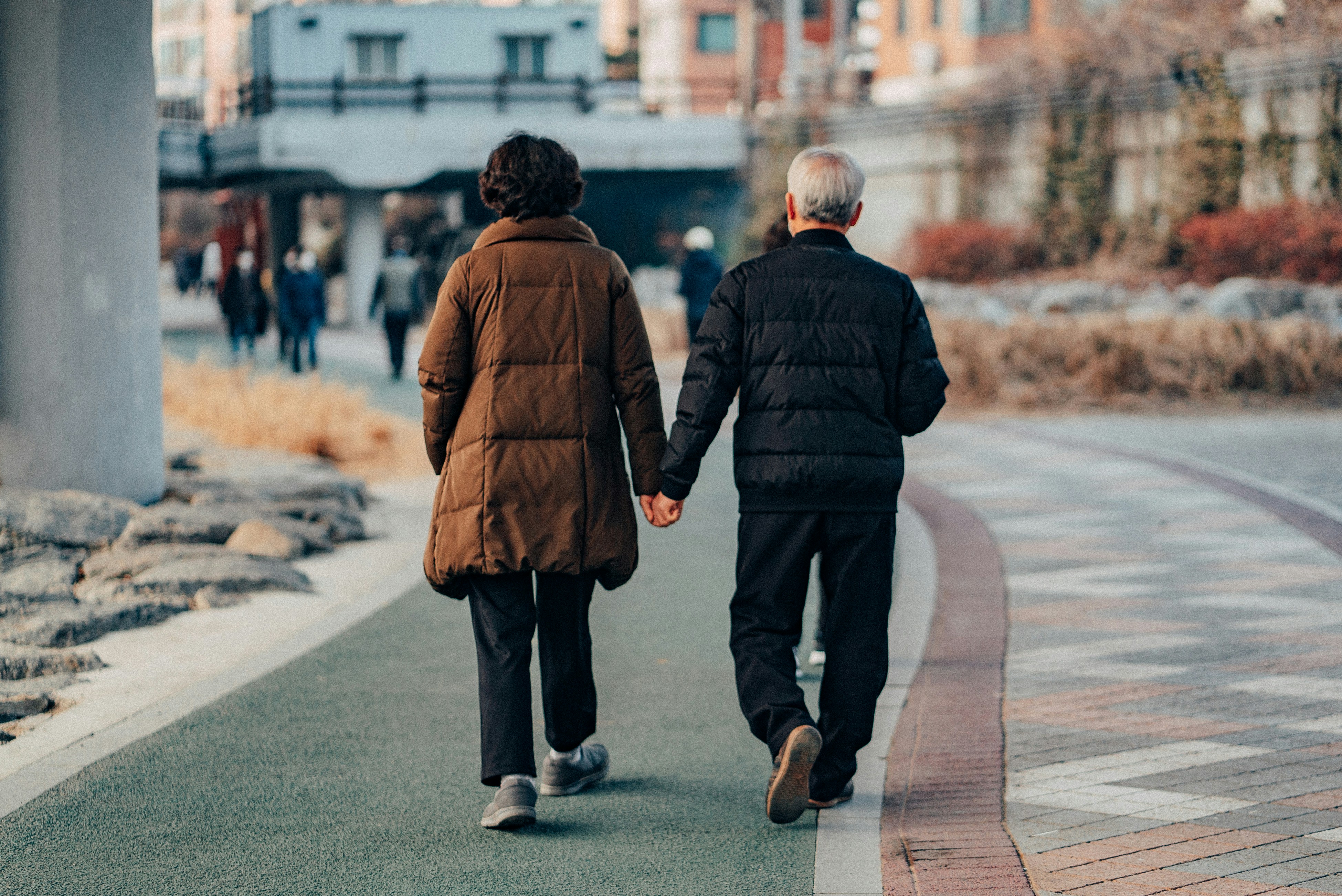 Photo by Unsplash An illustrative photo of people walking on sidewalk.