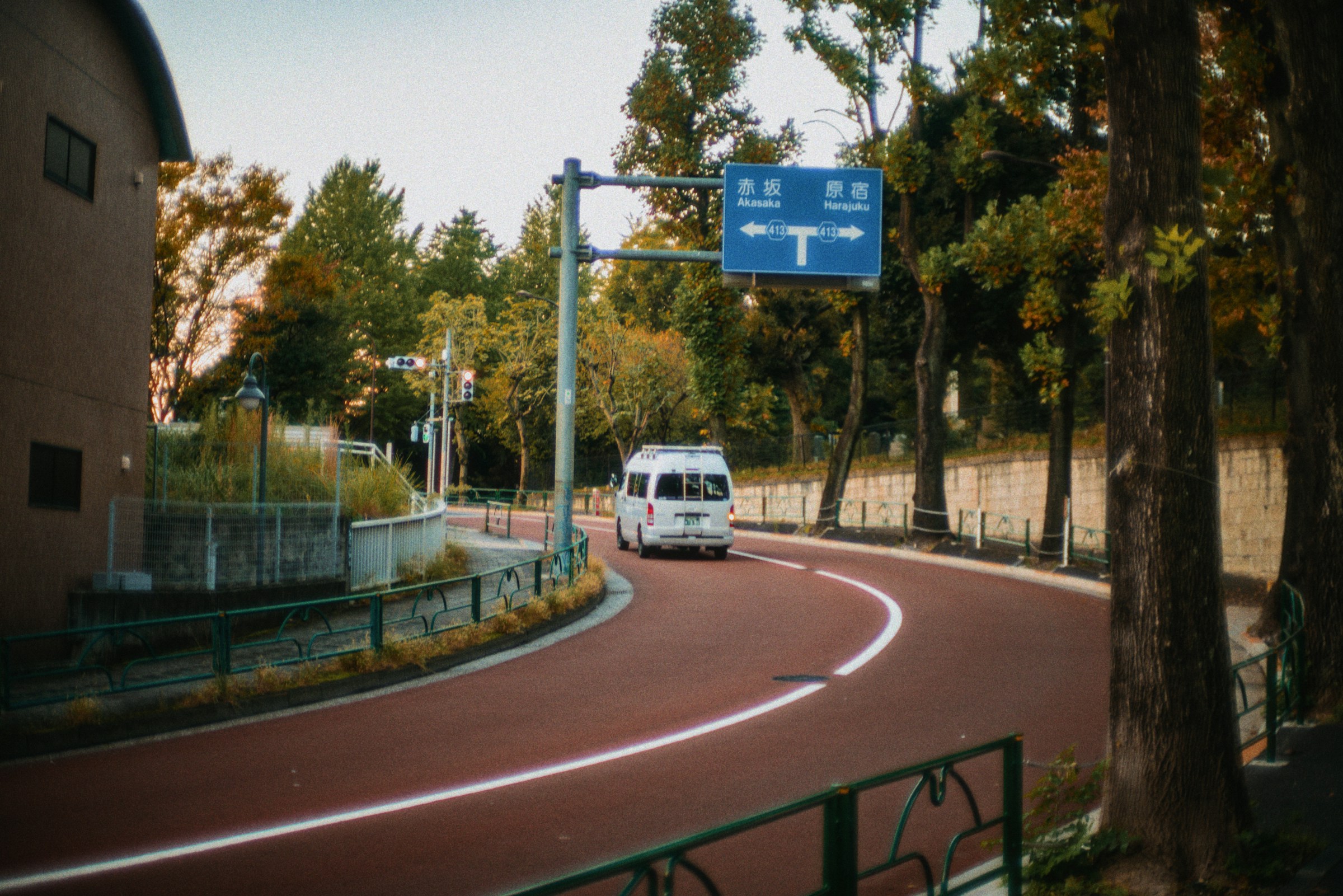 Photo by Unsplash An illustrative photo of a white van driving down a curvy road.