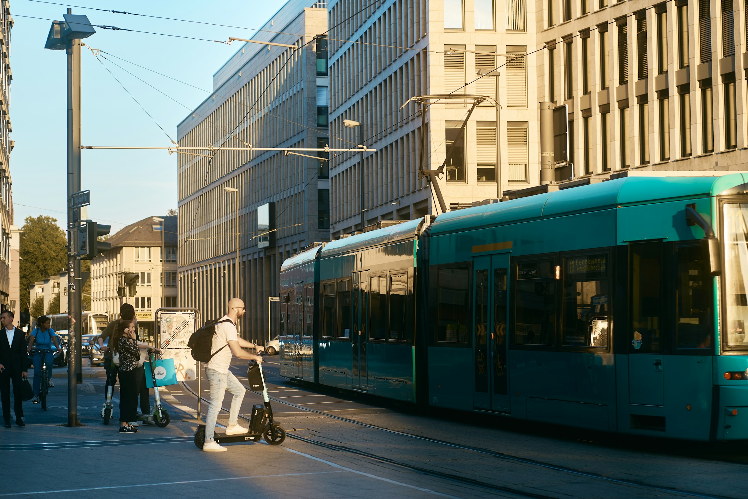 An illustrative photo of a group of people walking down a street.