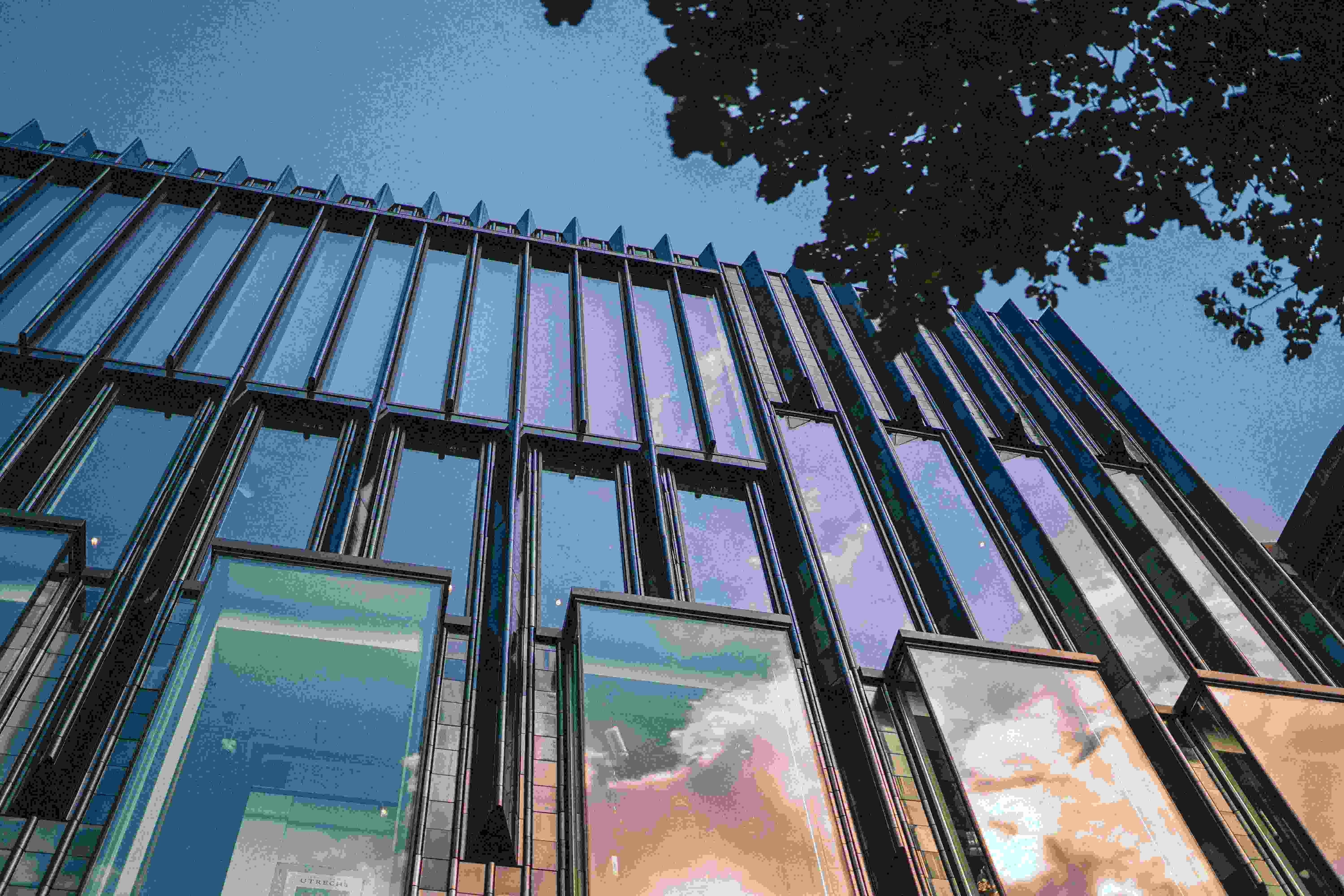 An illustrative photo of a very tall building with lots of windows.