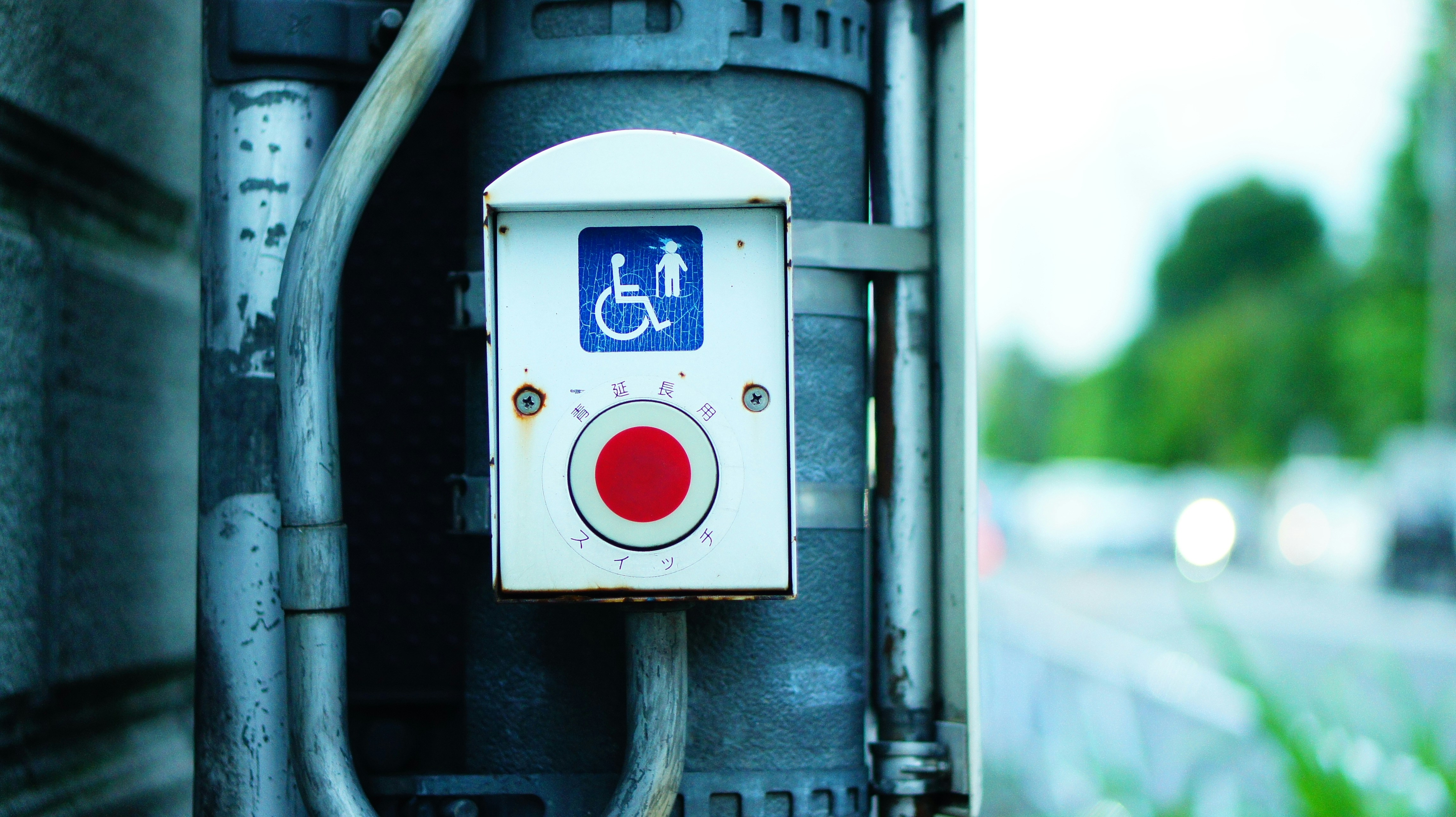 Photo by Unsplash An illustrative photo of a button for road-crossing for people with disabilities.