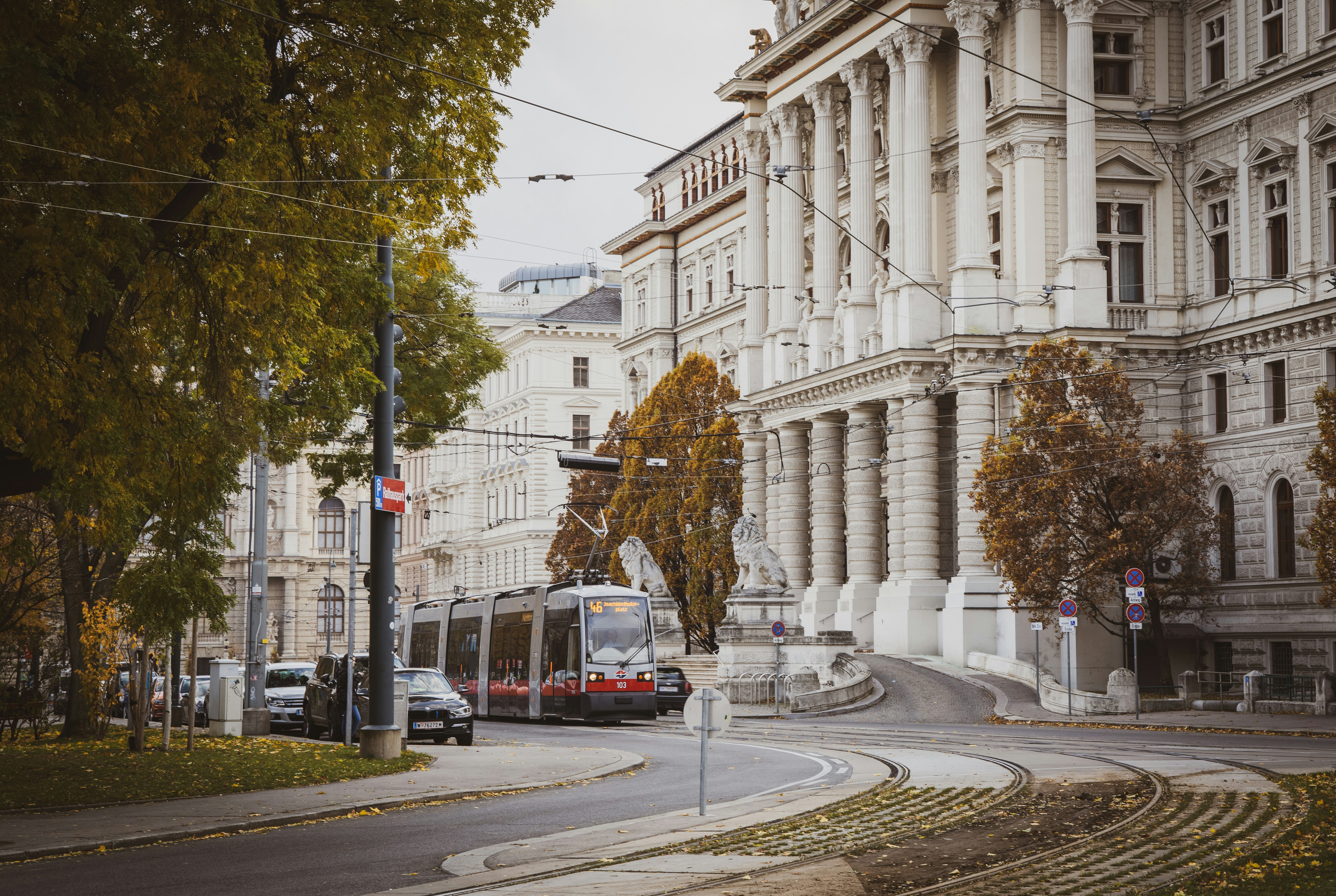 Photo by Unsplash An illustrative photo of a tram going near a big white building.