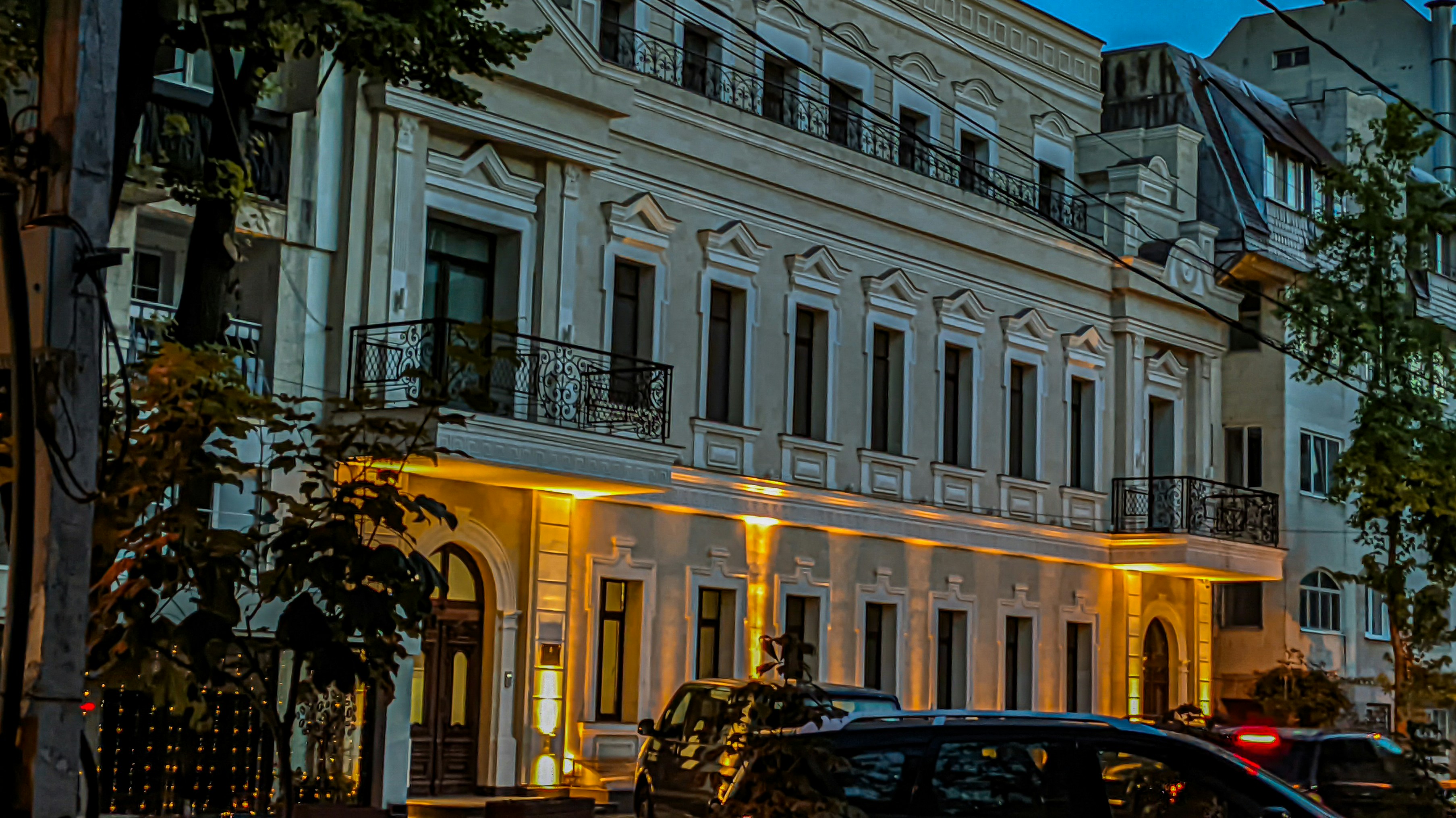 Photo by Unsplash An illustrative photo of a city street with cars parked on the side of it.