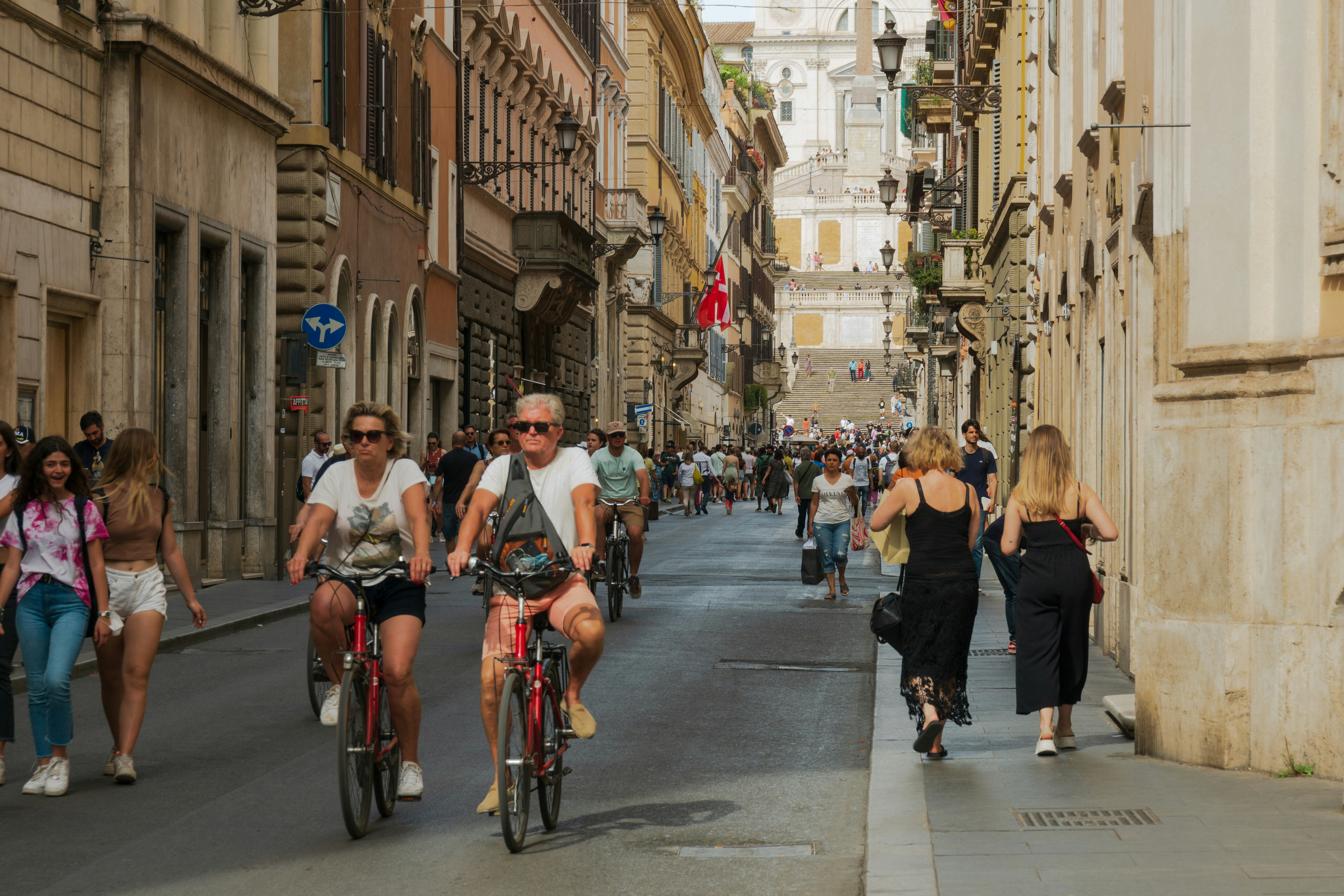 An illustrative photo of people riding bicycles in a city.