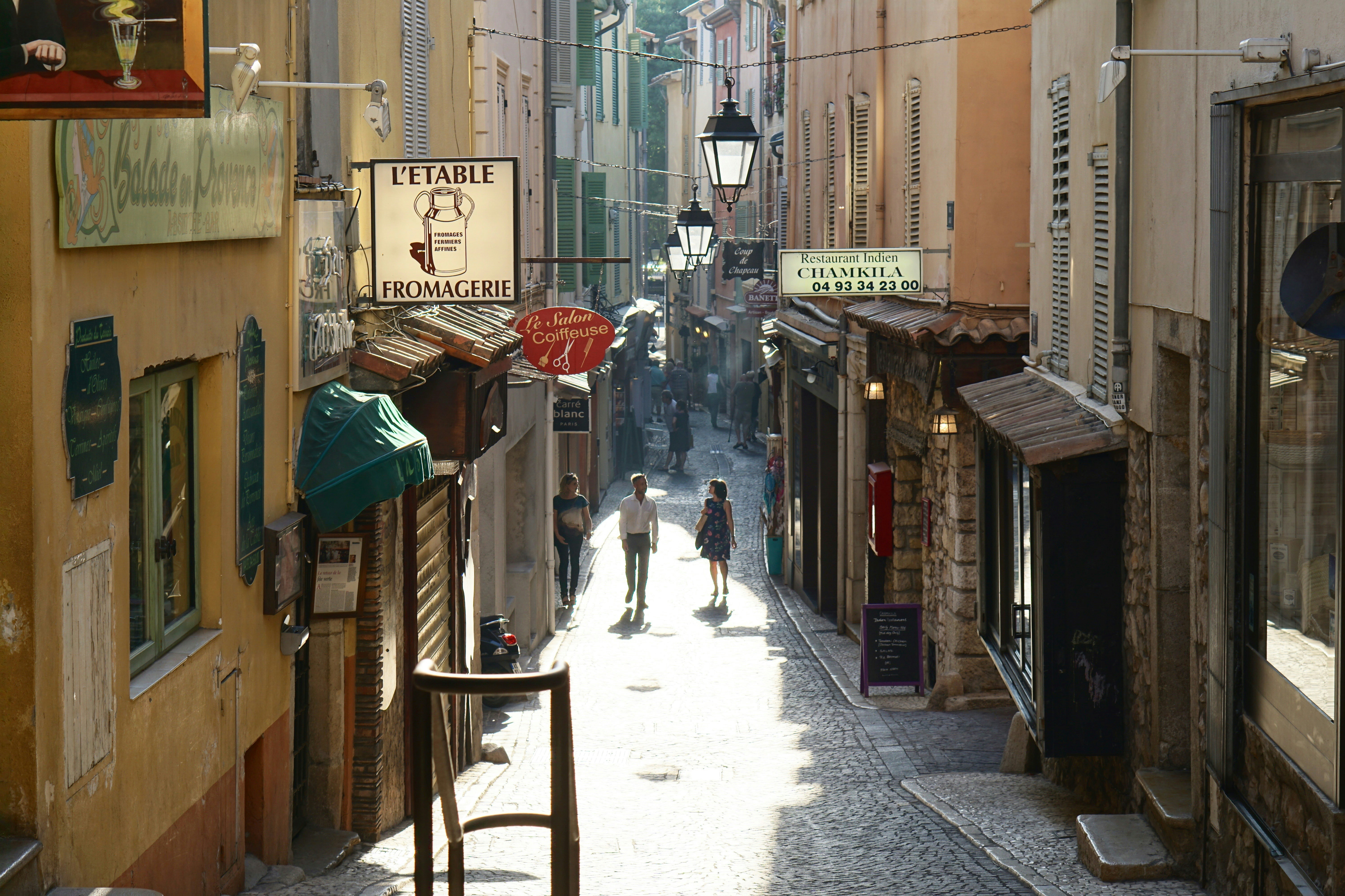 Photo by Unsplash An illustrative photo of people walking between buildings.