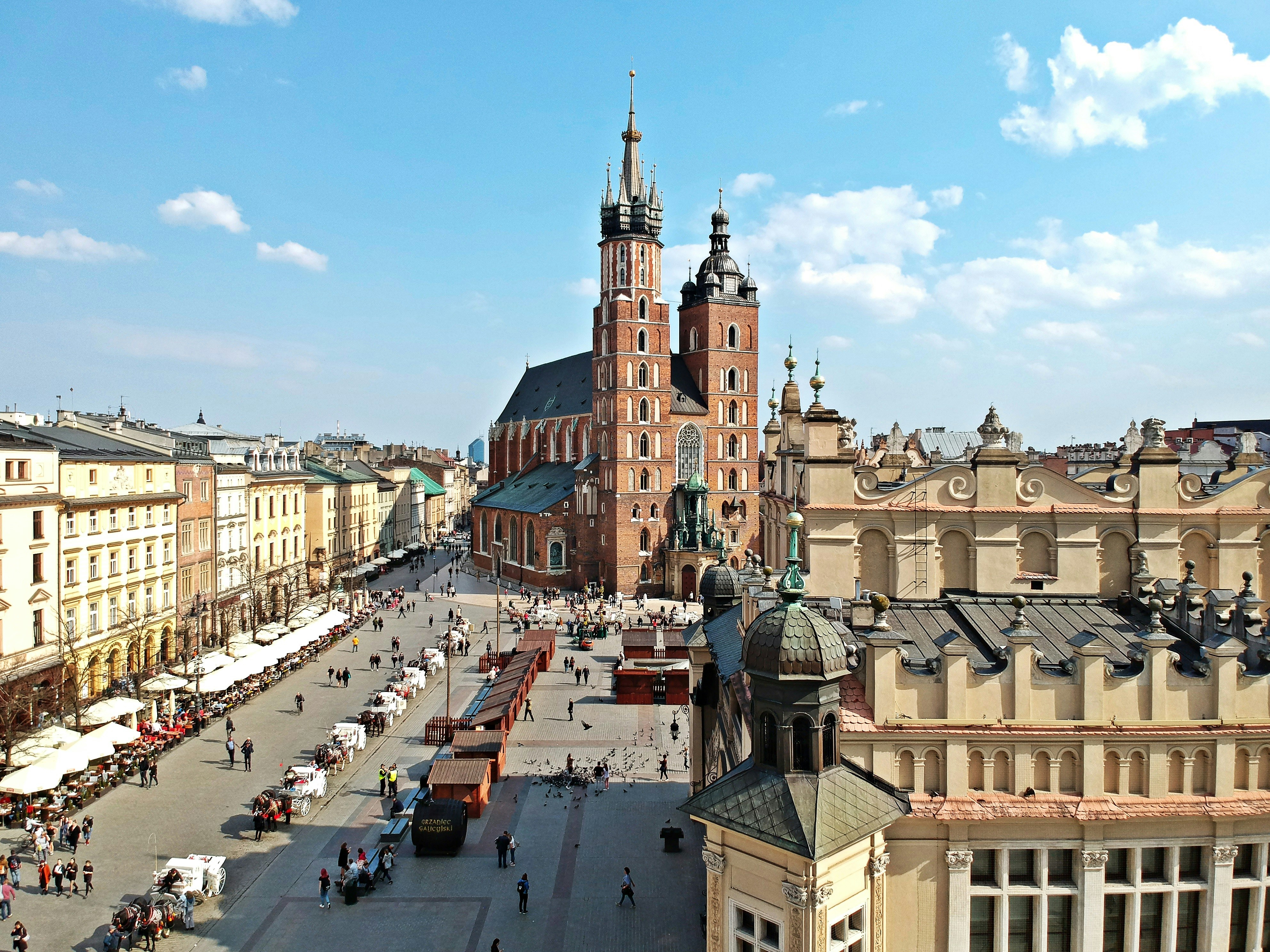 An illustrative photo of a view of a city square with a tower in the background.