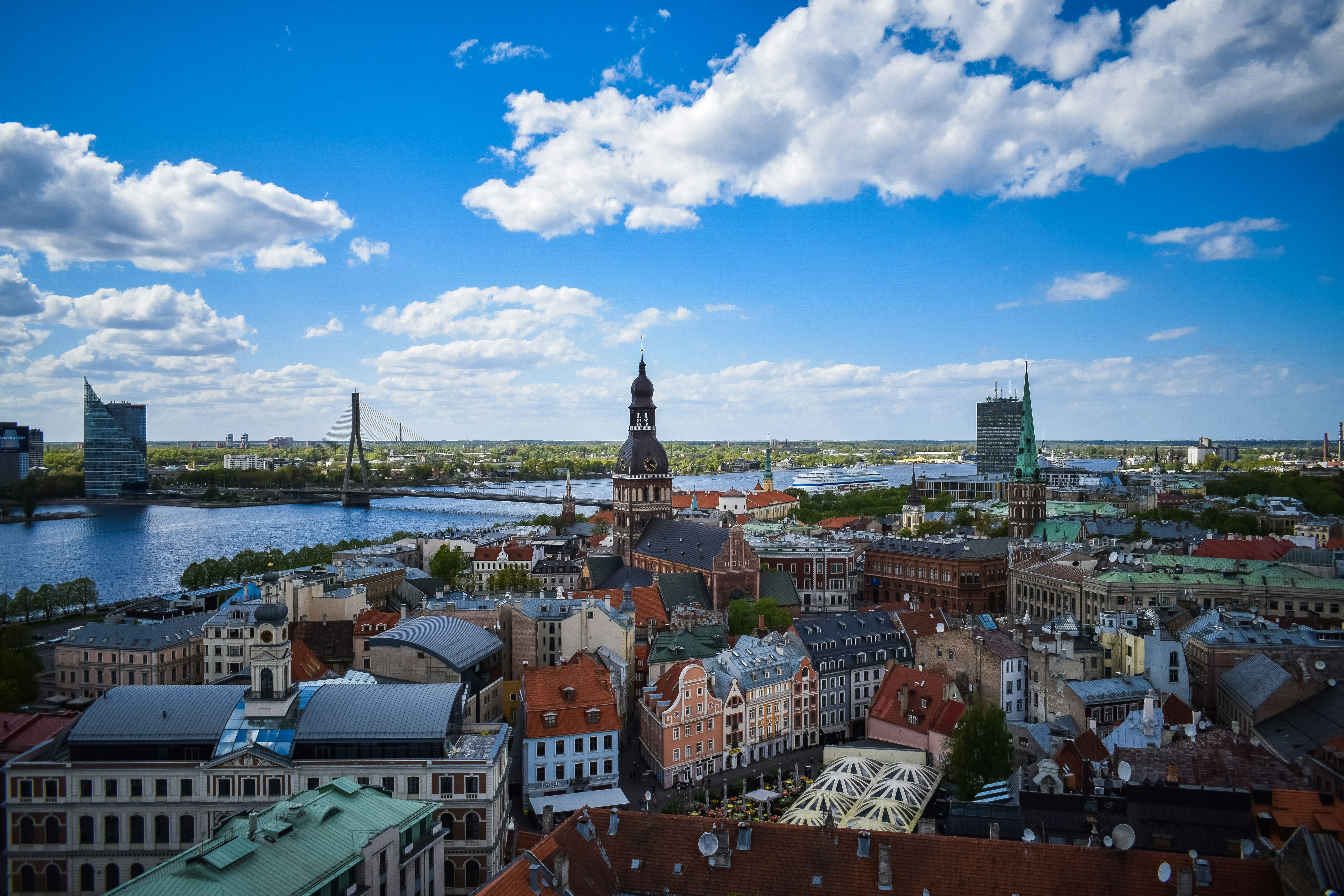 Photo by Unsplash An illustrative photo of a city by a river.
