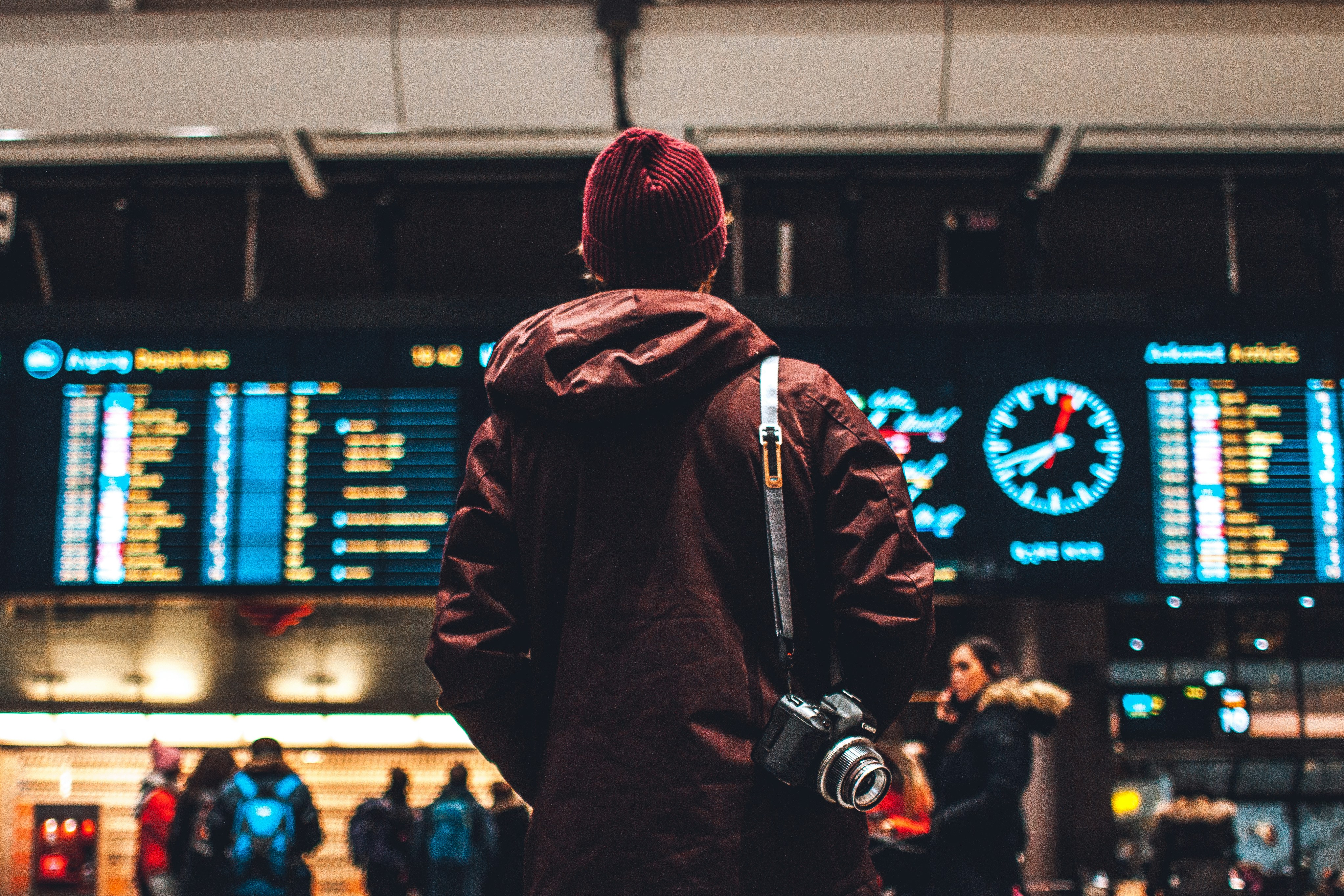 Photo by Unsplash An illustrative photo of a person looking up to the flight schedules.
