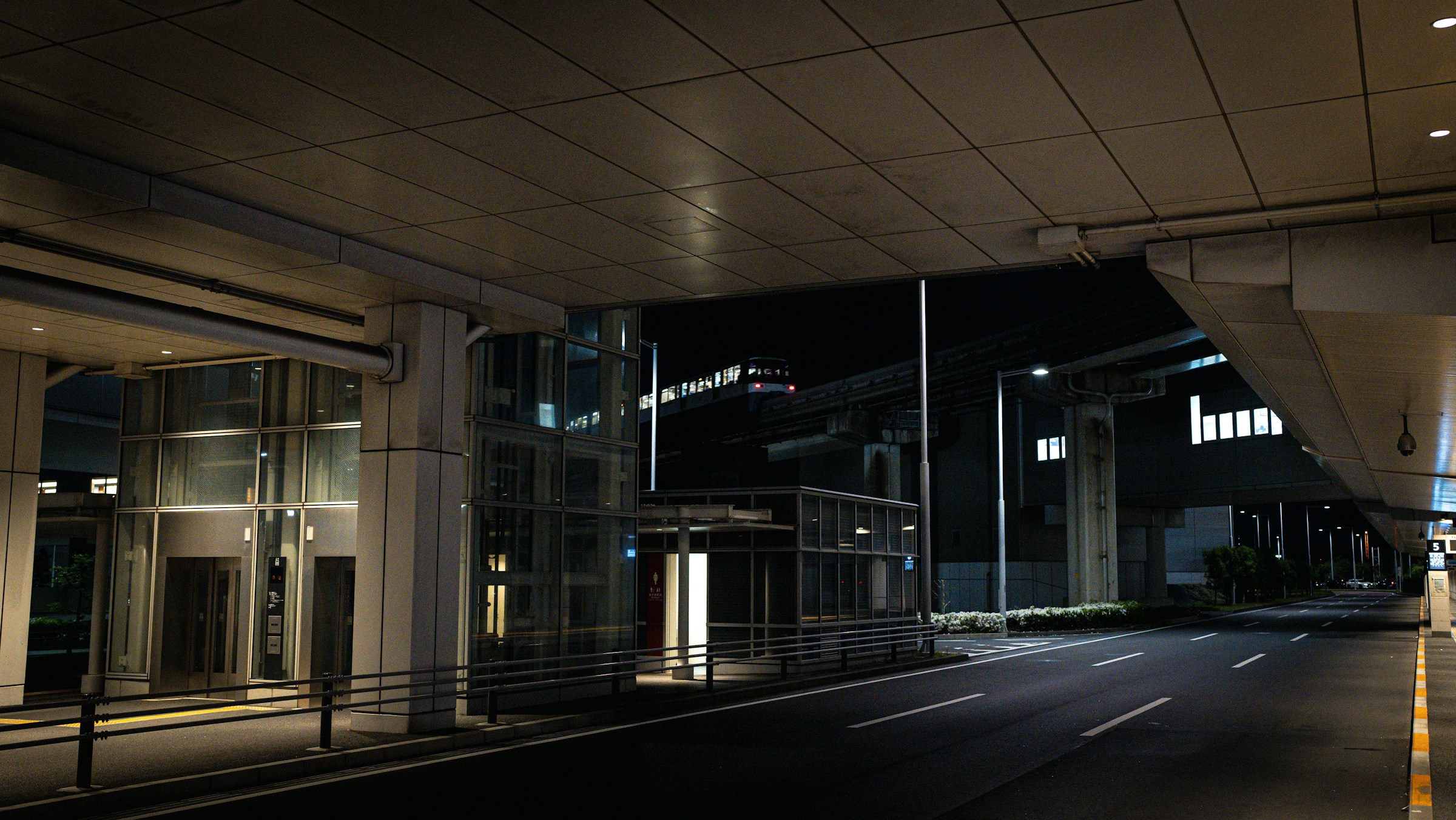 Photo by Unsplash An illustrative photo of an empty city street at night with a building.