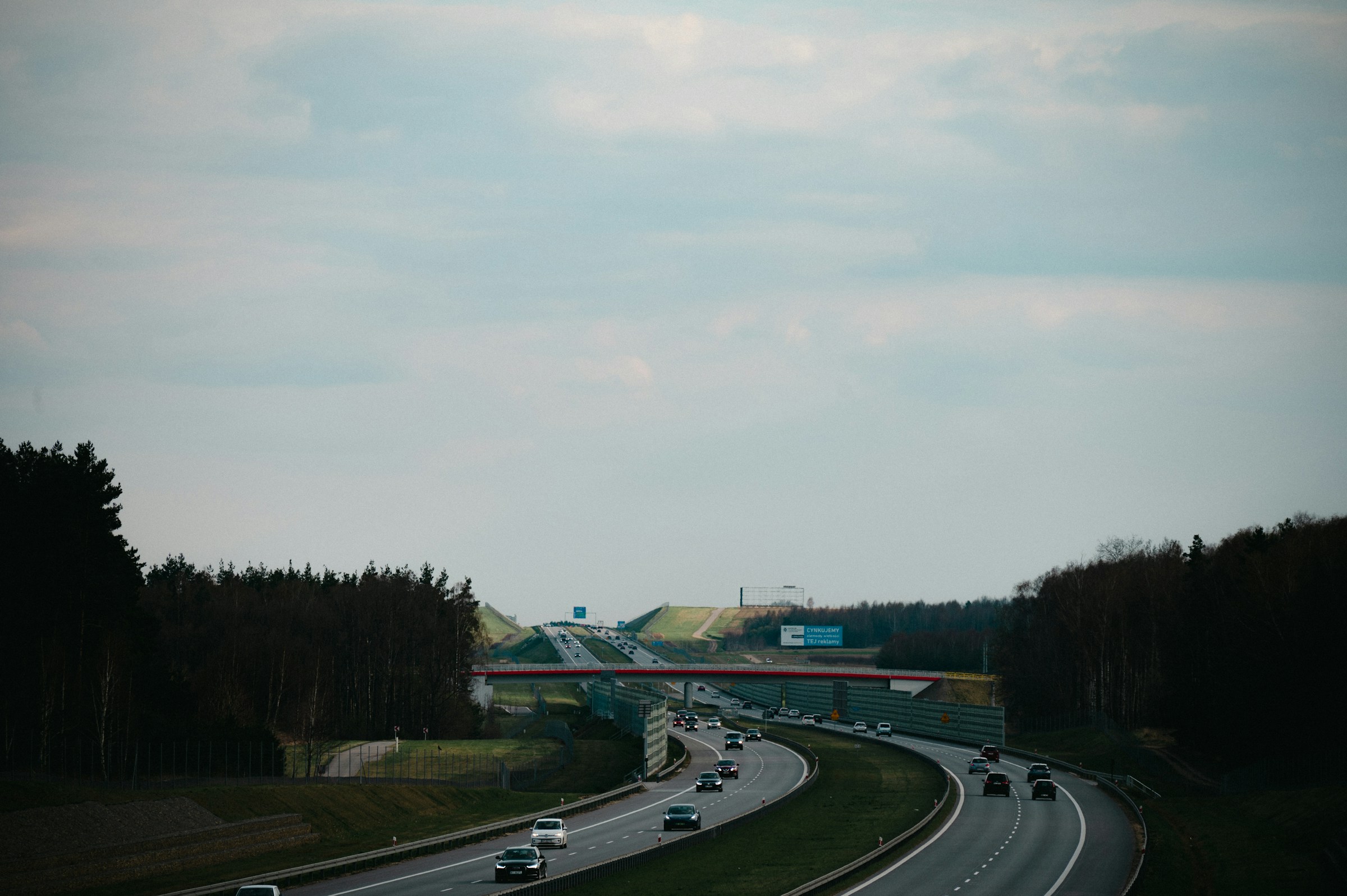An illustrative photo of a highway with cars.