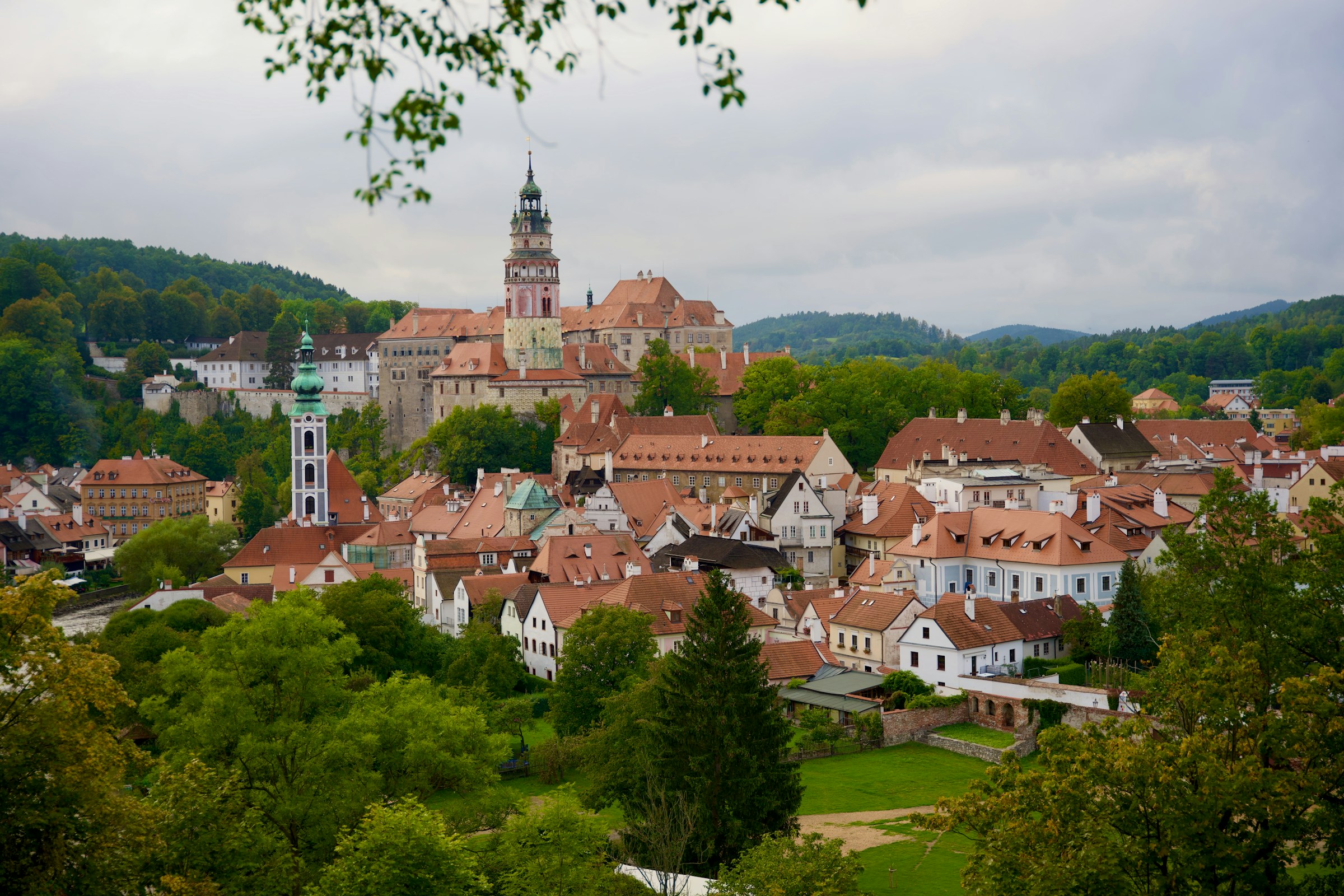 An illustrative photo of a view of a town from a hill.