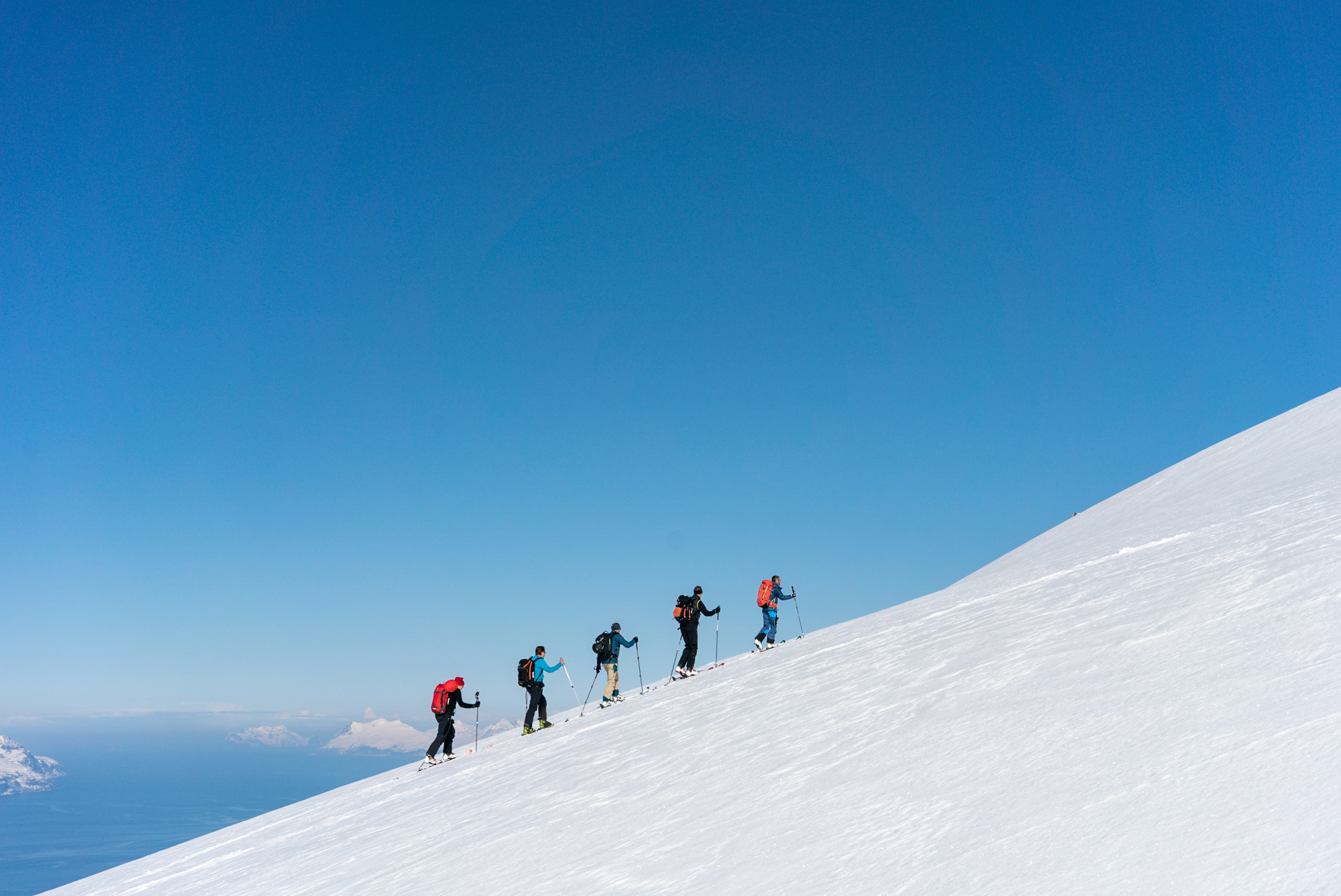 People climbing a snowy mountain