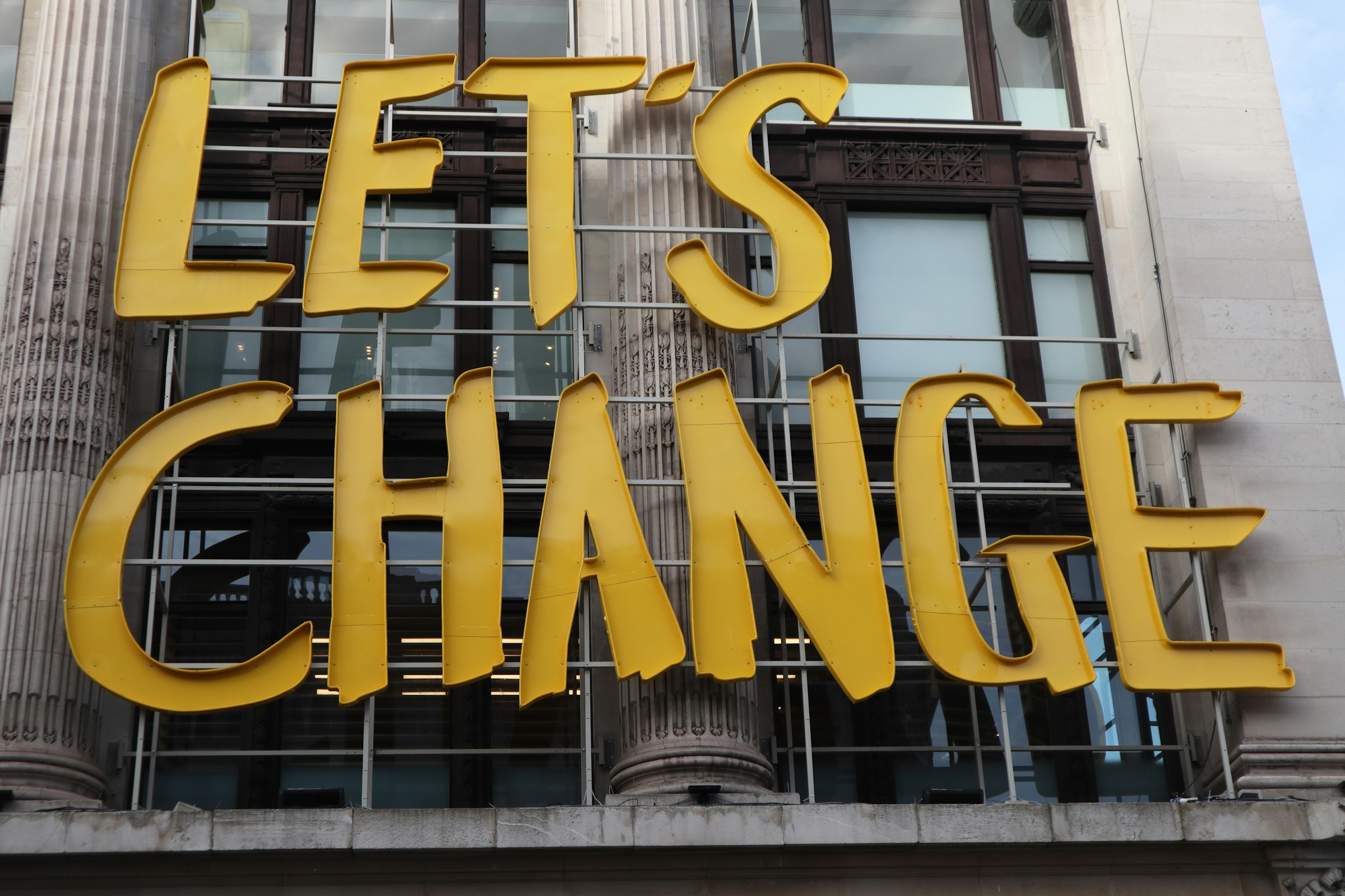  Street sign saying ‘Let’s Change’.  