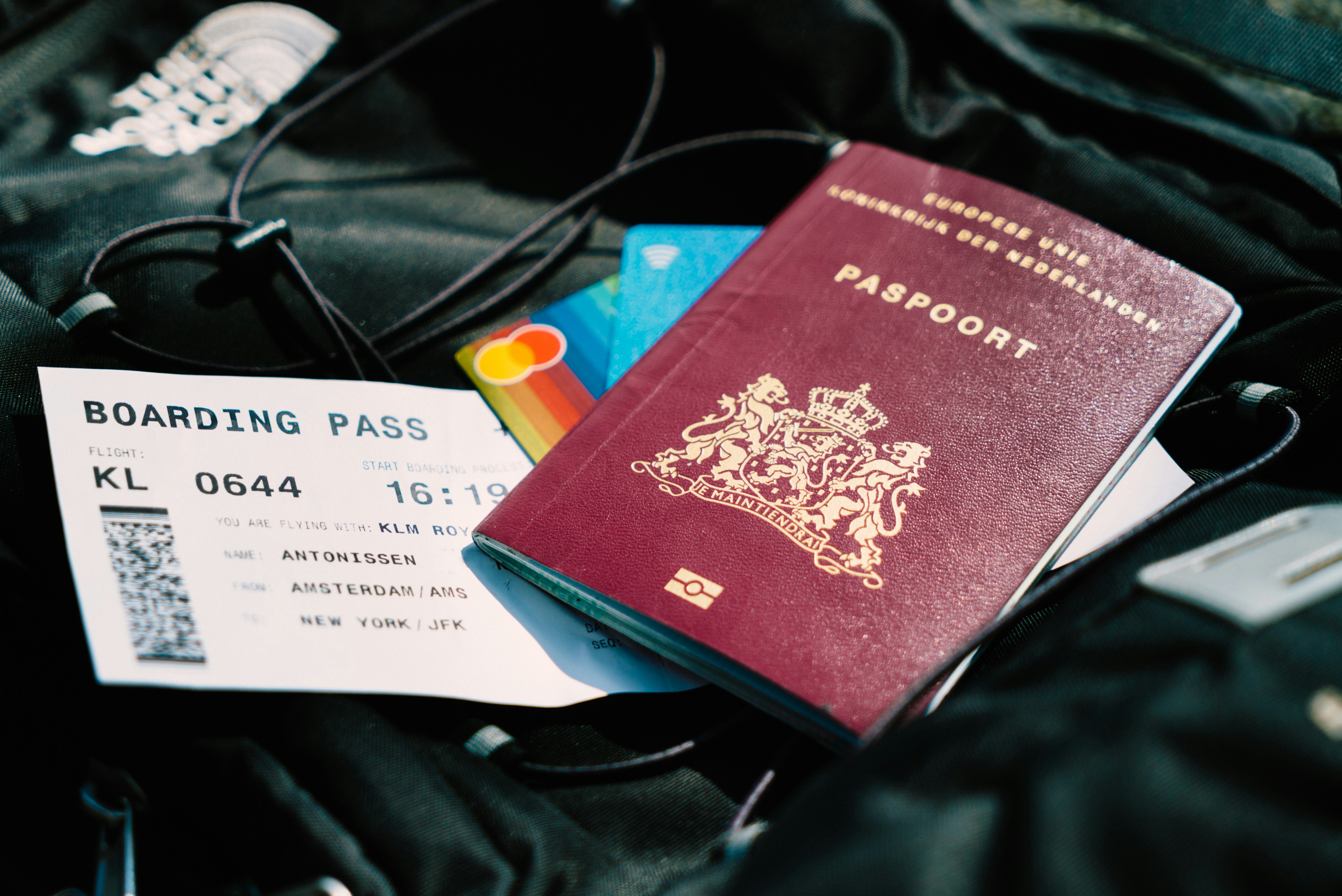 A passport with a boarding pass